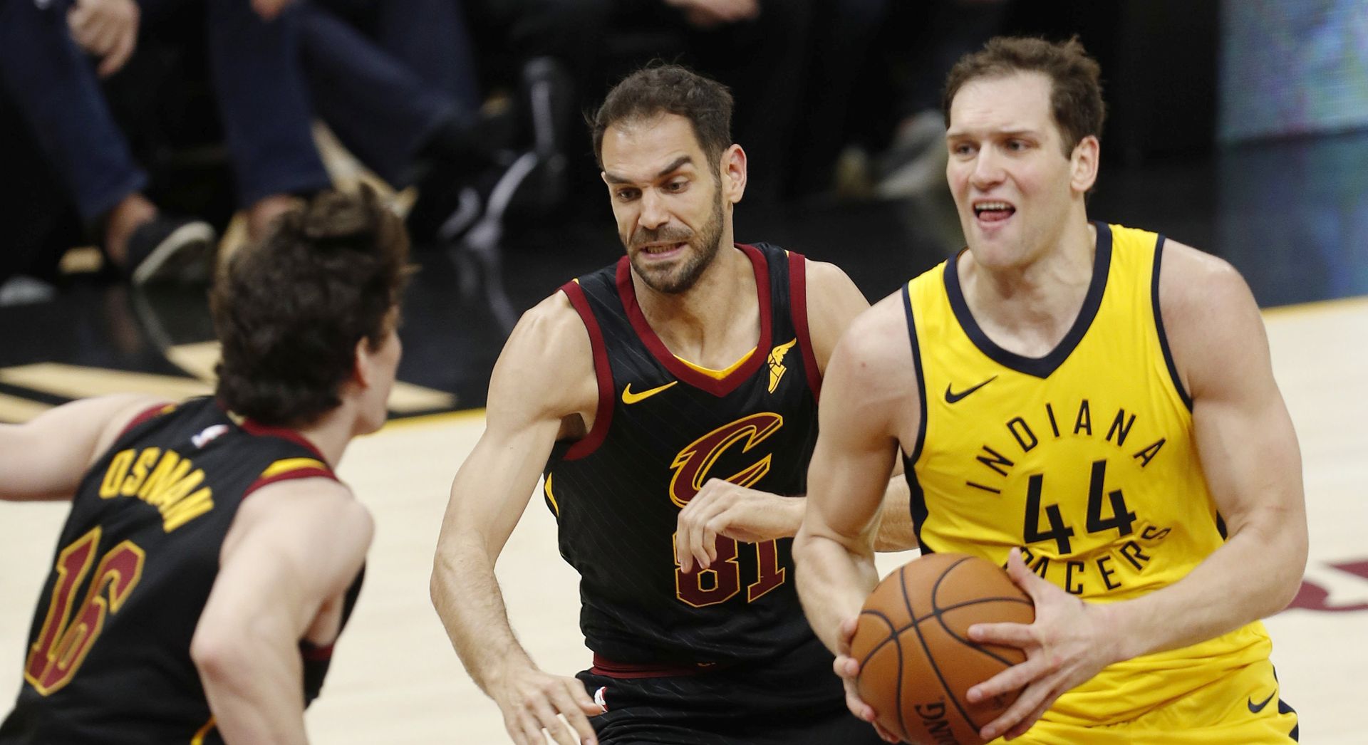 epa06672095 Indiana Pacers forward Bojan Bogdanovic of Croatia (R) drives to the basket against Cleveland Cavaliers guard Jose Calderon of Spain (C) and Cleveland Cavaliers forward Cedi Osman of Turkey (L) during the second half of game 1 of the Eastern Conference First Round Playoffs at Quicken Loans Arena in Cleveland, Ohio, USA, 15 April 2018.  EPA/DAVID MAXWELL  SHUTTERSTOCK OUT