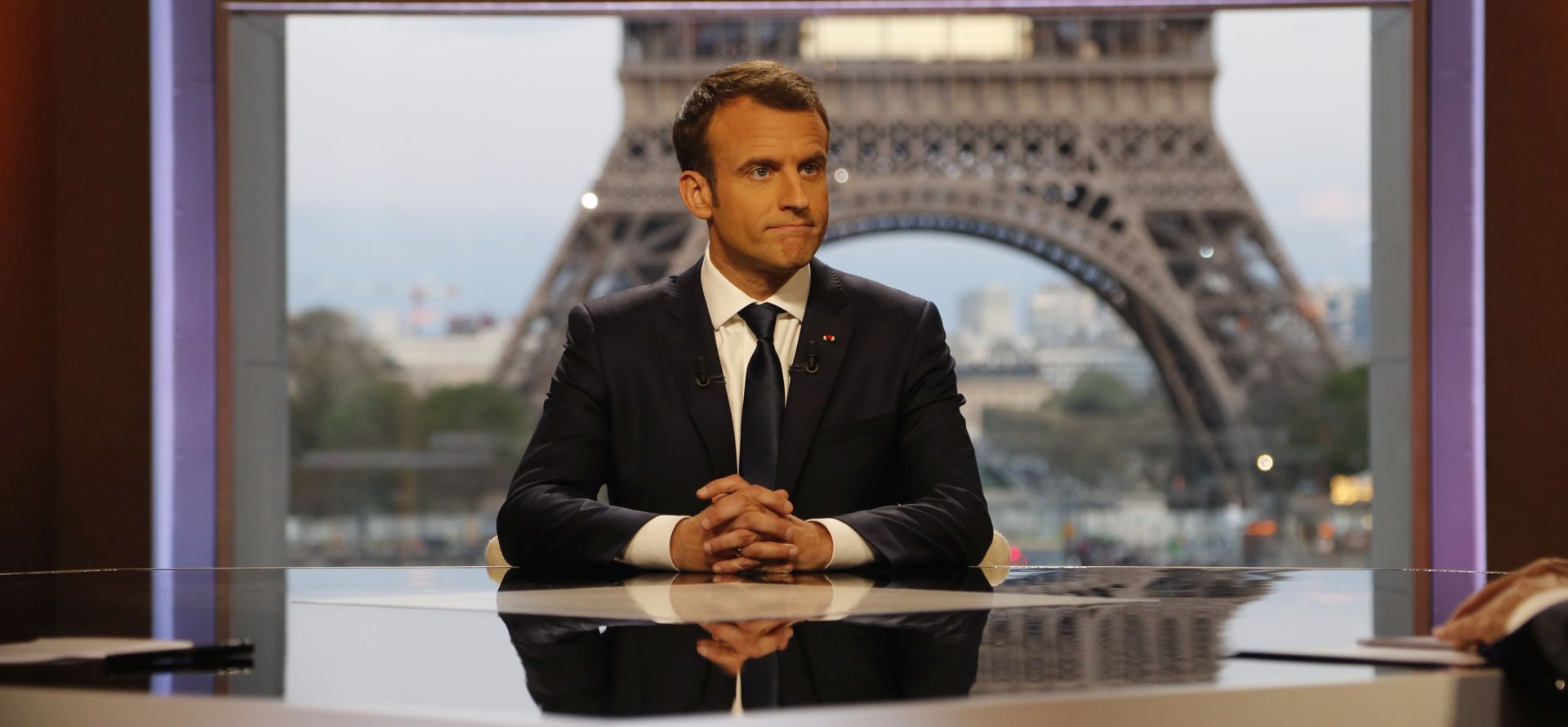 epa06671935 French President Emmanuel Macron (C) poses on the TV set before an interview with RMC-BFM and Mediapart French journalists at the Theatre national de Chaillot in Paris, 15 April 2018. Macron releases the interview after United States, Britain and France decided to launch air strikes in Syria in response to a suspected chemical weapons attack on 14 April 2018.  EPA/FRANCOIS GUILLOT / POOL MAXPPP OUT
