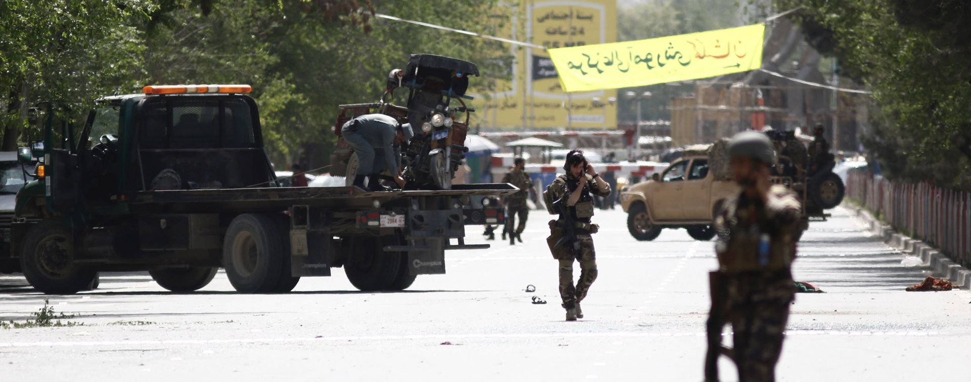 epa06702154 Afghan security officials inspect the scene of twin bomb blasts in Kabul, Afghanistan, 30 April 2018. According to reports, two explosions in central Kabul, near the headquarters of the Afghan intelligence services, killed at least 24 people, including five journalists.  EPA/JAWAD JALALI