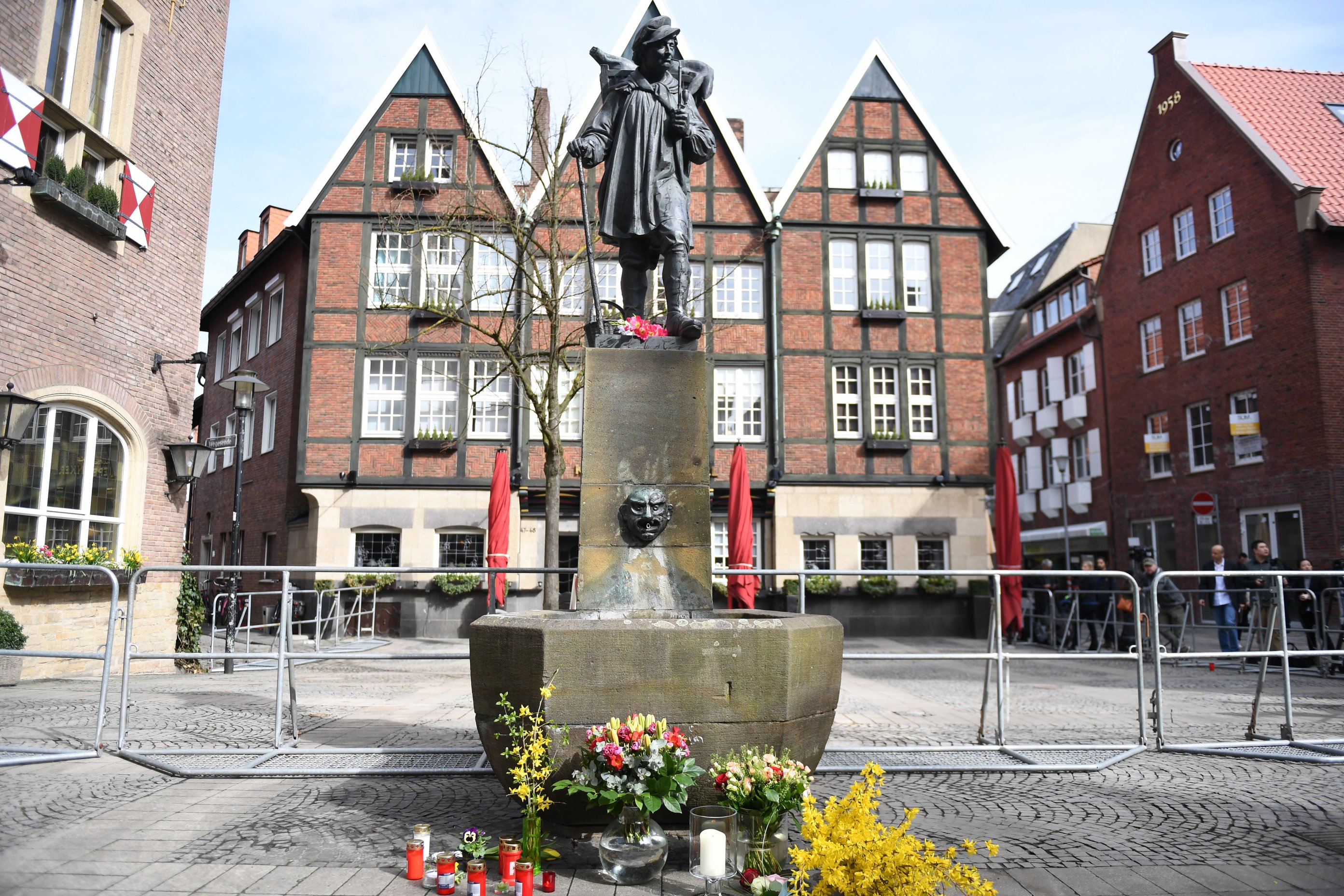 epa06654453 A general view of the scene in the inner city of Muenster, Germany, 08 April 2018, after a van drove into people sitting outside restaurants in the inner city on 07 April 2018. According to the police, a man drove a van into a crowd of people in the city of Muenster, western Germany, and then killed himself on 07 April. At least three people, including the driver, died and some 20 others were injured, media reported.  EPA/DAVID HECKER