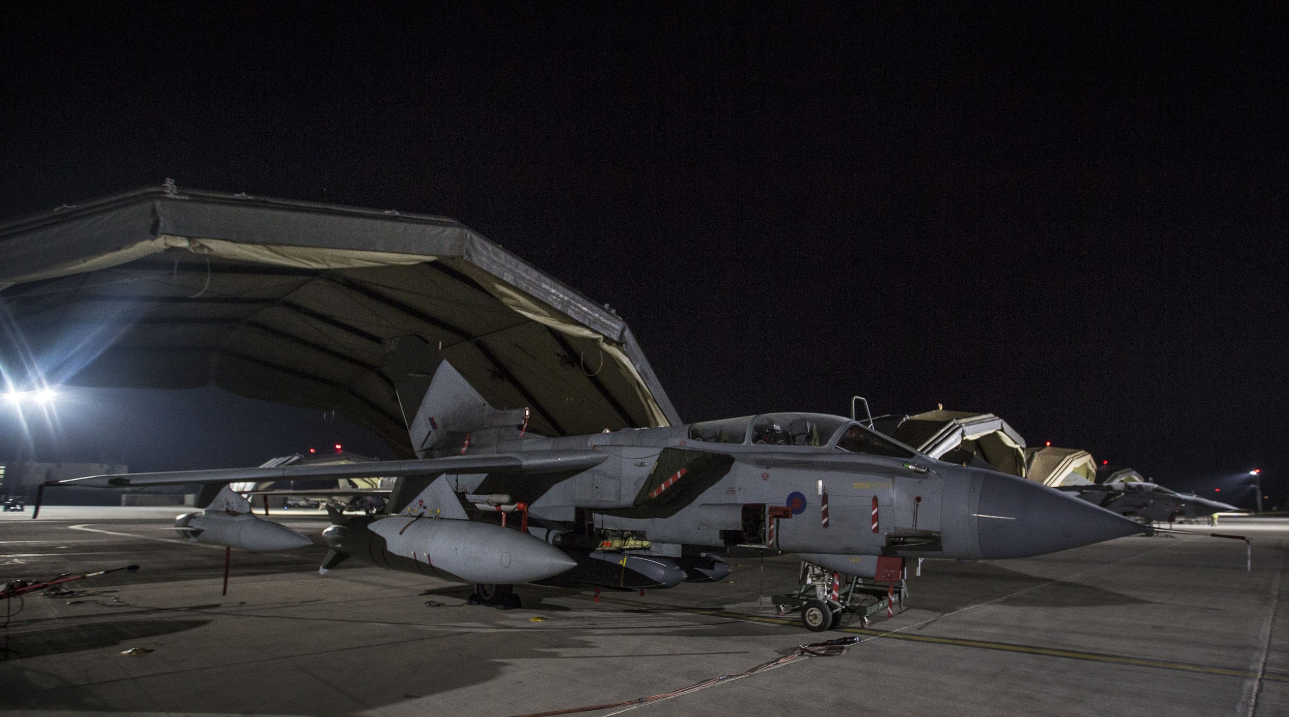 epa06667932 A handout photo made available by the British Ministry of Defence (MoD) showing a British Royal Air Force (RAF) Tornados sitting on the pan before launching at RAF Akrotiri, Cyprus, 14 April 2018.The MoD report that four RAF Tornado's took off on 14 April 2018 from RAF Akrotiri to conduct precision strikes on Syrian installations involved in the use of chemical weapons. The Tornados, flown by 31 Squadron the Goldstars, were supported by a Voyager aircraft. They launched Storm Shadow missiles at a military facility – a former missile base – some fifteen miles west of Homs, where the regime is assessed to keep chemical weapon precursors stockpiled in breach of Syria’s obligations under the Chemical Weapons Convention.  Very careful scientific analysis was applied to determine where best to target the Storm Shadows to maximise the destruction of the stockpiled chemicals and to minimise any risks of contamination to the surrounding area.  The facility which was struck is located some distance from any known concentrations of civilian habitation, reducing yet further any such risk.  EPA/Cpl L MATTHEWS / BRITISH MINISTRY OF DEFENCE / HANDOUT MANDATORY CREDIT MOD: CROWN COPYRIGHT HANDOUT EDITORIAL USE ONLY/NO SALES