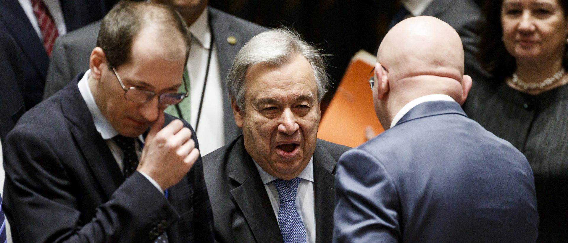 epa06666902 United Nations Secretary-General Antonio Guterres (C) shakes hands with Vassily Nebenzia (R), Russian Ambassador to the United Nations, as diplomats gather for an United Nations Security Council meeting called by Russia in response to the escalating situation in Syria following suspected chemical weapons attack at United Nations headquarters in New York, New York, USA, 13 April 2018. The suspected chemical attack took place last weekend in the Damascus suburb of Douma, killing at least 49 people.  EPA/JUSTIN LANE