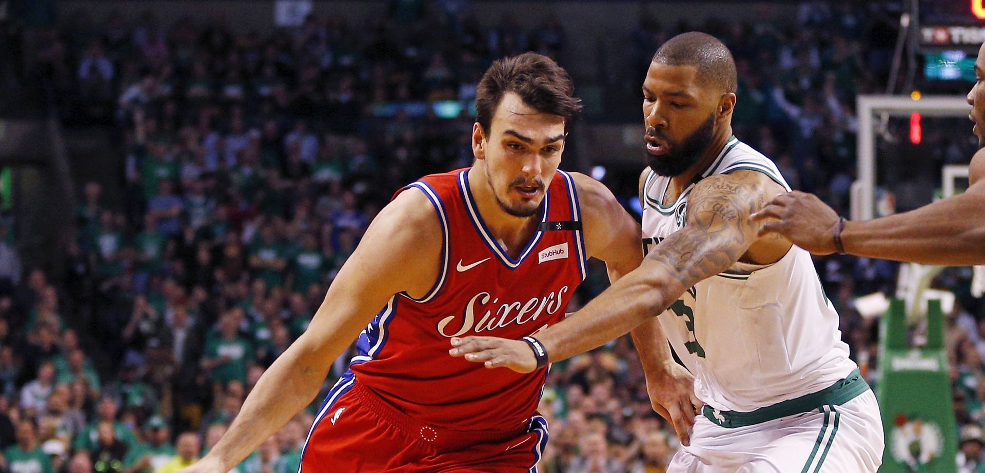 epa06703353 Philadelphia 76ers forward Dario Saric (L) of Croatia drives past Boston Celtics forward Marcus Morris (R) during the third quarter of the Eastern Conference First Round playoff game one between the Boston Celtics and the Philadelphia 76ers at the TD Garden in Boston, Massachusetts, USA, 30 April 2018.  EPA/CJ GUNTHER  SHUTTERSTOCK OUT
