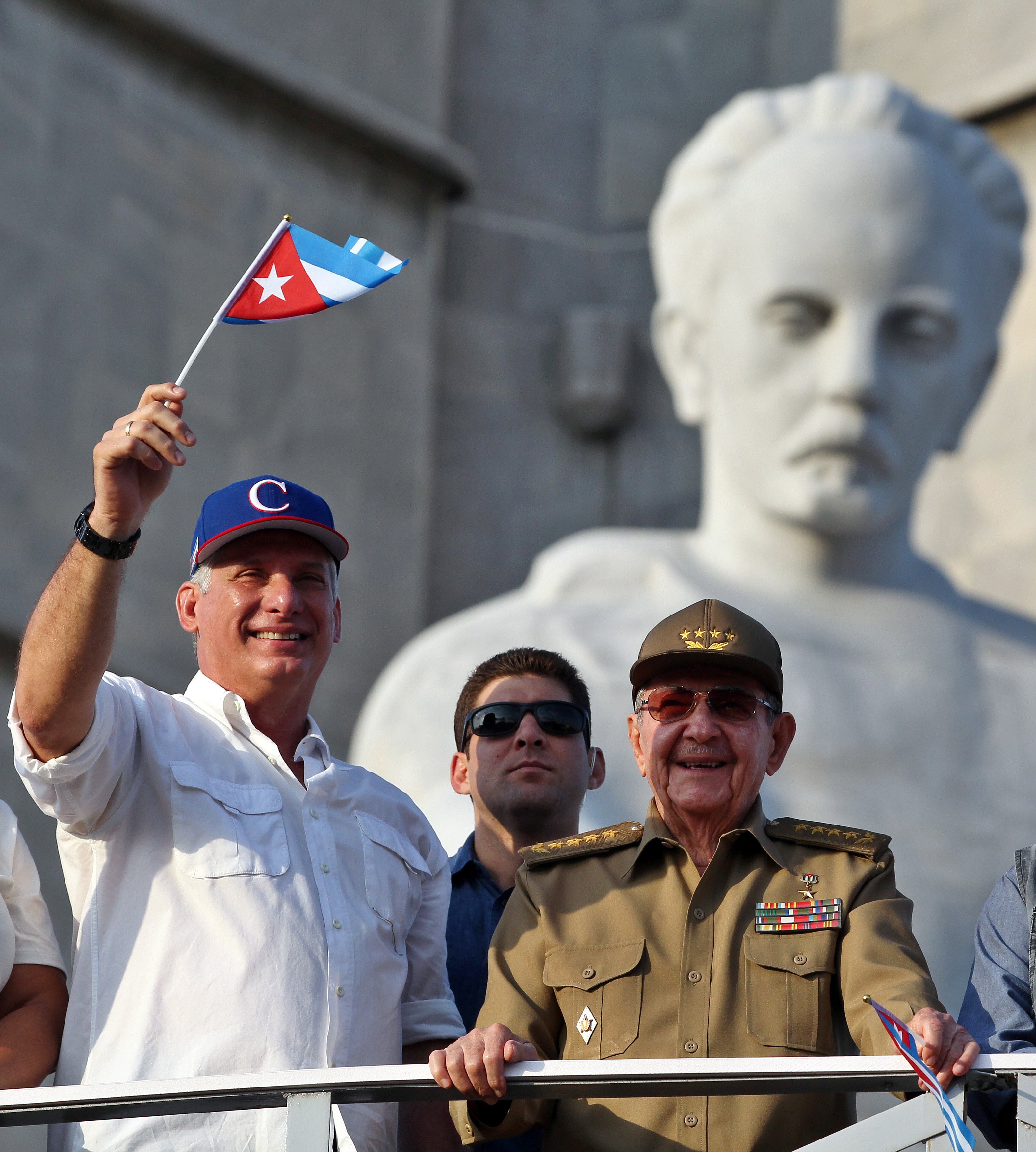 epa06704657 Cuban President Miguel Diaz-Canel (L) and his predecessor and First Secretary of the Communist Party Raul Castro (R) greet during a parade to commemorate the Labour Day, at the Revolution Square in Havana, Cuba, 01 May 2018. Hundreds of thousands of people marched in a day in which labor demands were absent and all the leading role was charged with the message of support for the new president Miguel Diaz-Canel and the validity of the revolutionary legacy.  EPA/Alejandro Ernesto