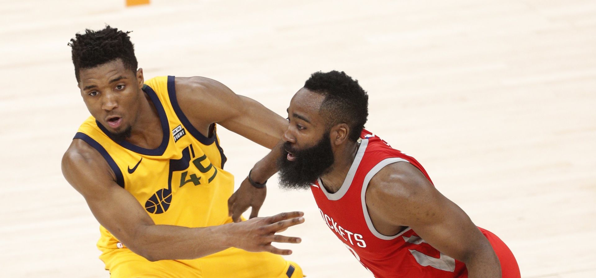 epa06716104 Houston Rockets guard James Harden (R) drives the ball as Utah Jazz guard Donovan Mitchell (L) defends in the second half of the NBA Western Conference Semifinals playoff basketball game four between the Houston Rockets and the Utah Jazz at the Vivint Smart Home Arena in Salt Lake City, Utah, USA, 06 May 2018.  EPA/GEORGE FREY  SHUTTERSTOCK OUT