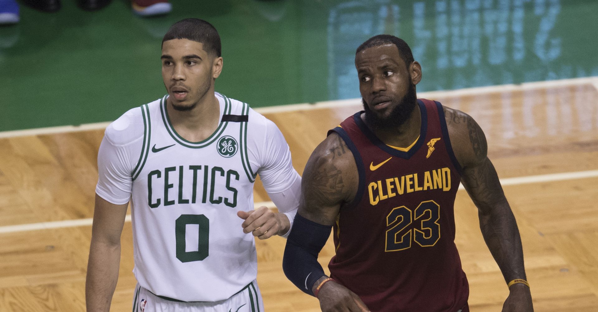 epa06734361 Boston Celtics' Jayson Tatum (L) and Cleveland Cavaliers' LeBron James in the 4th quarter during the Eastern Conference Championship game one between the Cleveland Cavaliers and the Boston Celtics at the TD Garden in Boston, Massachusetts, USA 13 May 2018.  EPA/JOHN CETRINO  SHUTTERSTOCK OUT