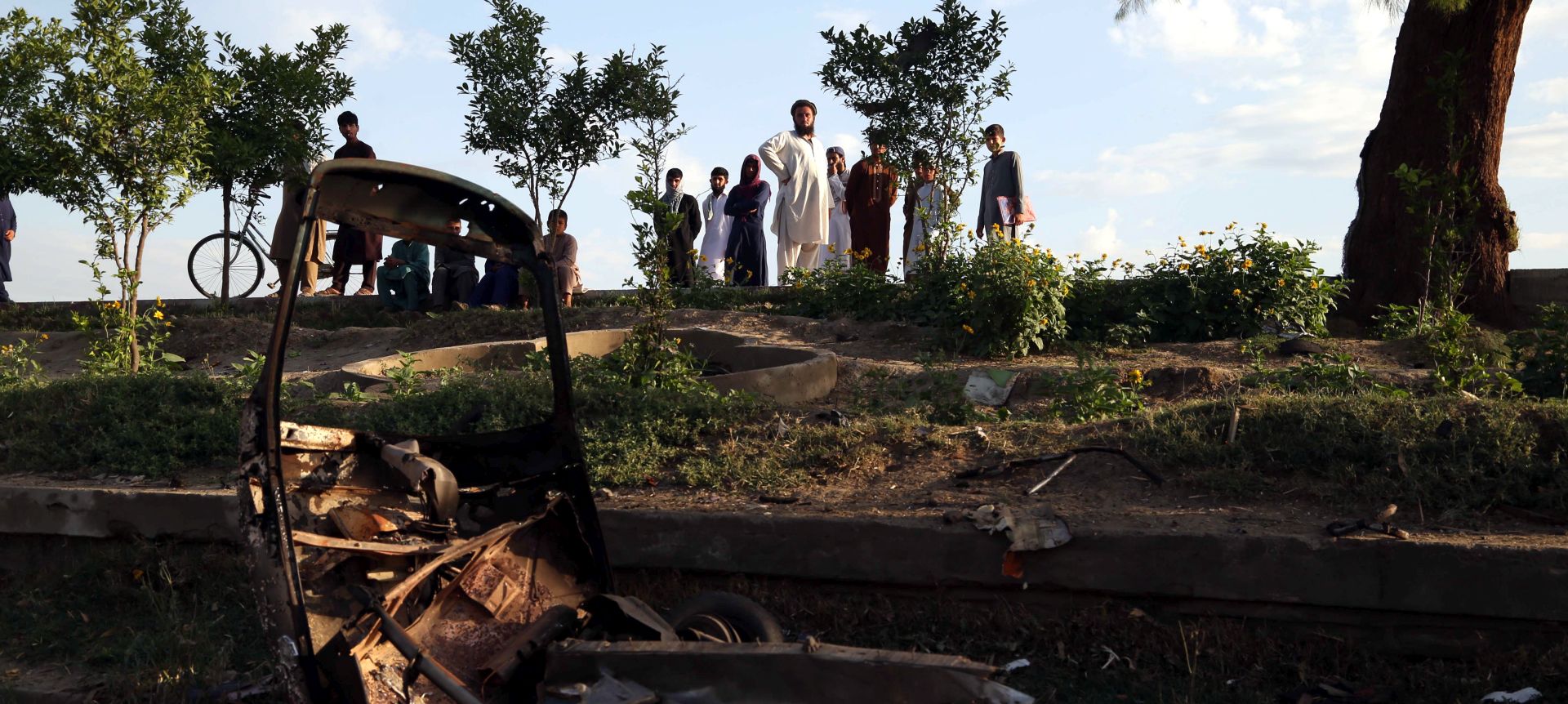 epa06748594 People survey the Cricket ground where three bombs exploded in Jalalabad, Afghanistan, 19 May 2018. At least eight people died and another 43 were wounded in three consecutive explosions during a cricket match held at night in Jalalabad. The blasts occurred around midnight at the Spinghar cricket stadium in the capital of Nangarhar, where hundreds of people had gone to watch a match between local teams, according to Nangarhar governor's spokesperson Attaullah Khogyanai.  EPA/GHULAMULLAH HABIBI