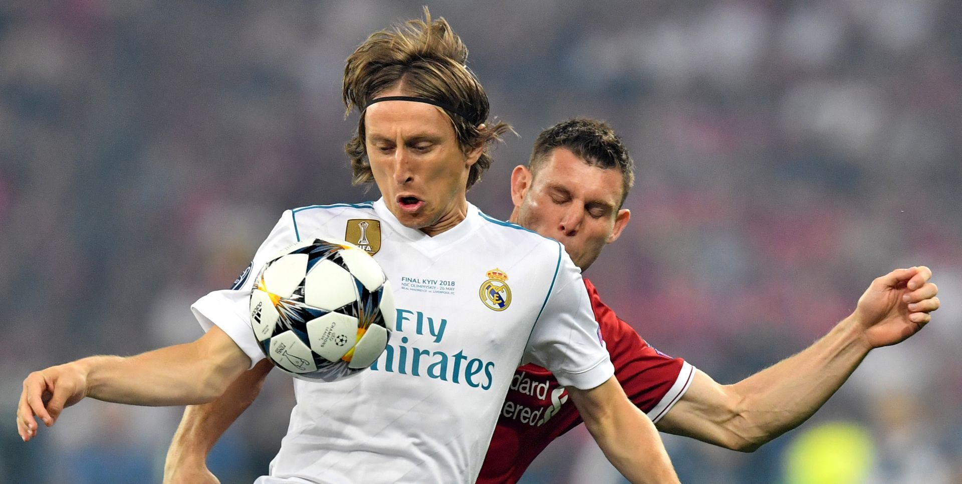 epa06765453 Real Madrid's Luka Modric (front) and James Milner of Liverpool FC in action during the UEFA Champions League final between Real Madrid and Liverpool FC at the NSC Olimpiyskiy stadium in Kiev, Ukraine, 26 May 2018.  EPA/GEORGI LICOVSKI