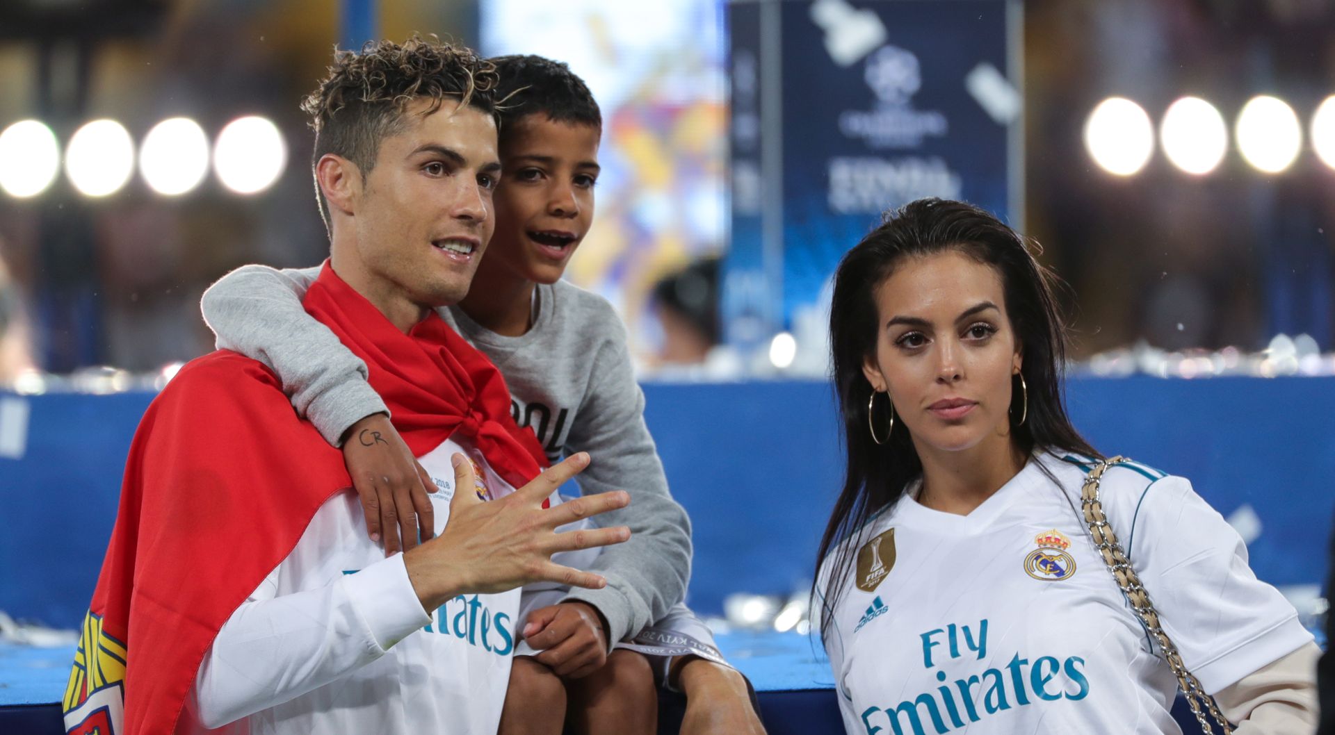 epa06766189 Cristiano Ronaldo of Real Madrid and his son Cristiano Ronaldo Jr. and girlfriend Georgina Rodriguez celebrate after the UEFA Champions League final between Real Madrid and Liverpool FC at the NSC Olimpiyskiy stadium in Kiev, Ukraine, 26 May 2018. Madrid won 3-1.  EPA/ARMANDO BABANI