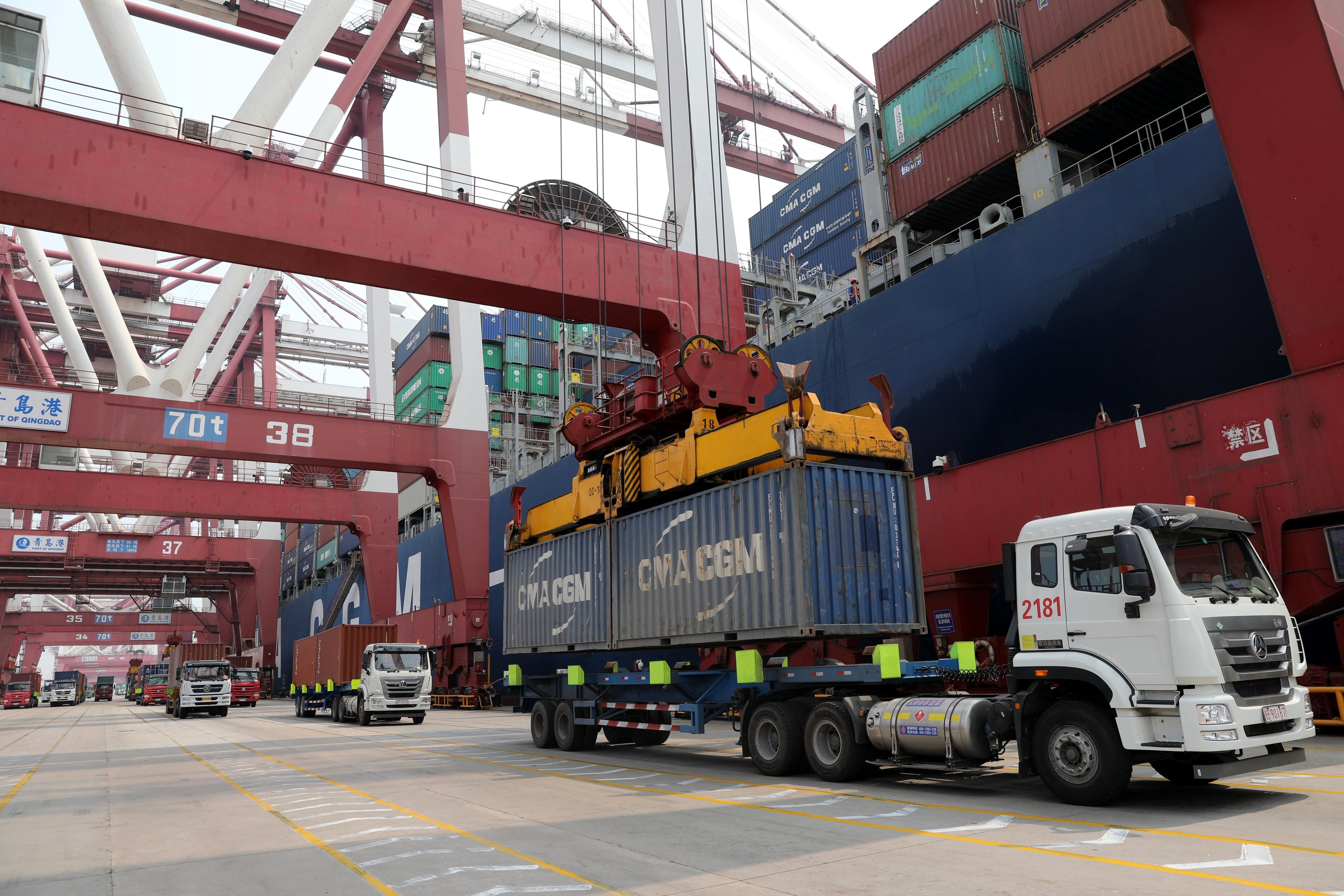 epa06702426 Trucks transport containers at the Port of Qingdao in Qingdao, China's Shandong province, 30 April 2018. China opposes the latest so-called 'Special 301 Report on intellectual property rights' which was issued on 27 April 2018 by the Office of the United State Trade Representative, the Ministry of Commerce said on 28 April 2018. The report puts 36 countries, including China for the 14th year in a row, on a watchlist for protecting intellectual property rights of the US.  EPA/WU HONG