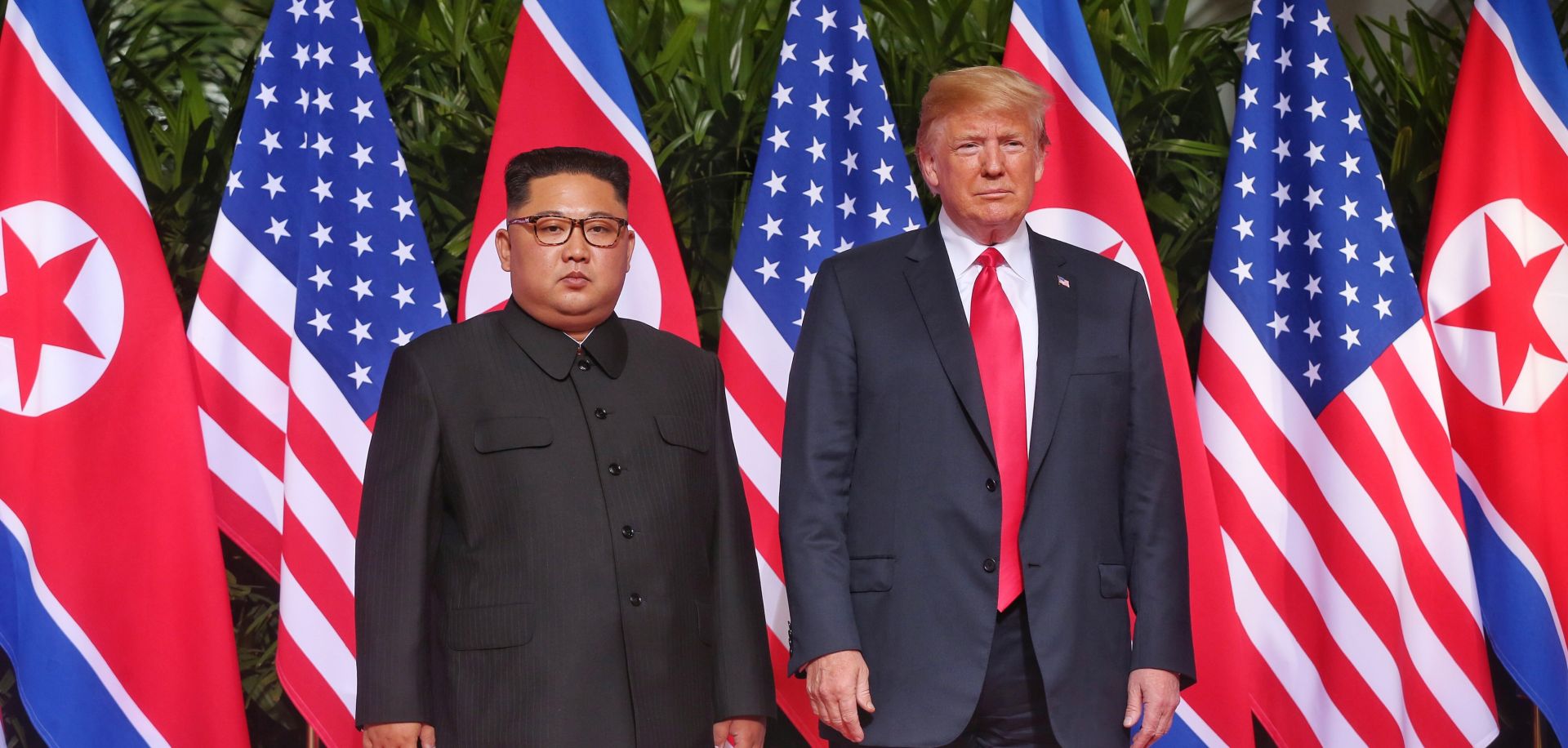 epa06801338 US President Donald J. Trump (R) and North Korean leader Kim Jong-un (L) pose for a photo at the start of a historic summit at the Capella Hotel on Sentosa Island, Singapore, 12 June 2018. The summit marks the first meeting between an incumbent US President and a North Korean leader.  EPA/KEVIN LIM / THE STRAITS TIMES / SPH SINGAPORE OUT  EDITORIAL USE ONLY