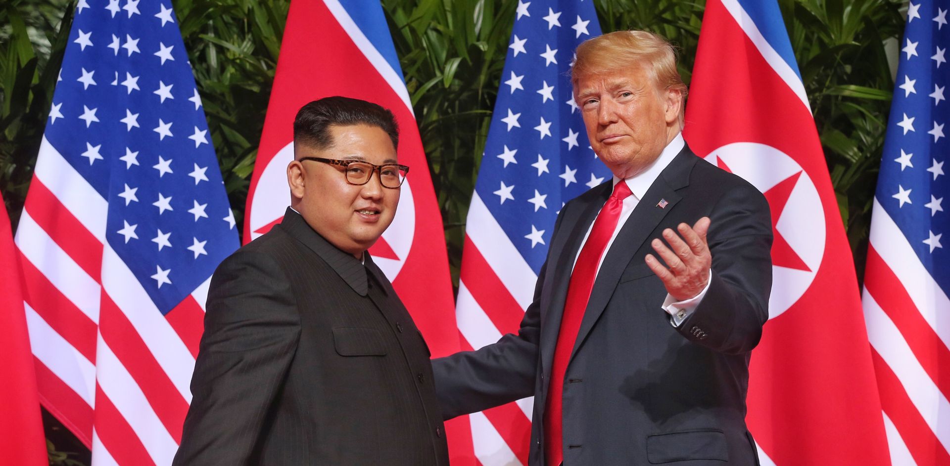 epa06801336 US President Donald J. Trump (R) and North Korean leader Kim Jong-un (L) meet at the start of a historic summit at the Capella Hotel on Sentosa Island, Singapore, 12 June 2018. The summit marks the first meeting between an incumbent US President and a North Korean leader.  EPA/KEVIN LIM / THE STRAITS TIMES / SPH SINGAPORE OUT  EDITORIAL USE ONLY
