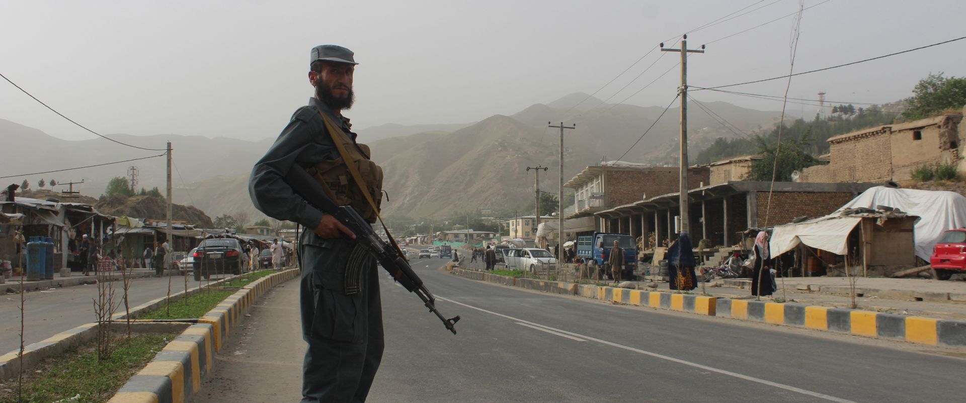 epa06808451 An Afghan security official stands guard on a road on the eve of Eid al-Fitr in Badakhshan, Afghanistan, 14 June 2018. Muslims around the world are preparing to celebrate Eid al-Fitr, the three day festival marking the end of the Muslim holy month of Ramadan, it will be observed on 15th or 16th of June depending on the lunar calendar. Eid al-Fitr is one of the two major holidays in Islam. The Taliban announced on Saturday a ceasefire in Afghanistan for three days, starting from the beginning of Eid, the festival which marks the end of Ramadan.  EPA/SHARIF SHAYAQ