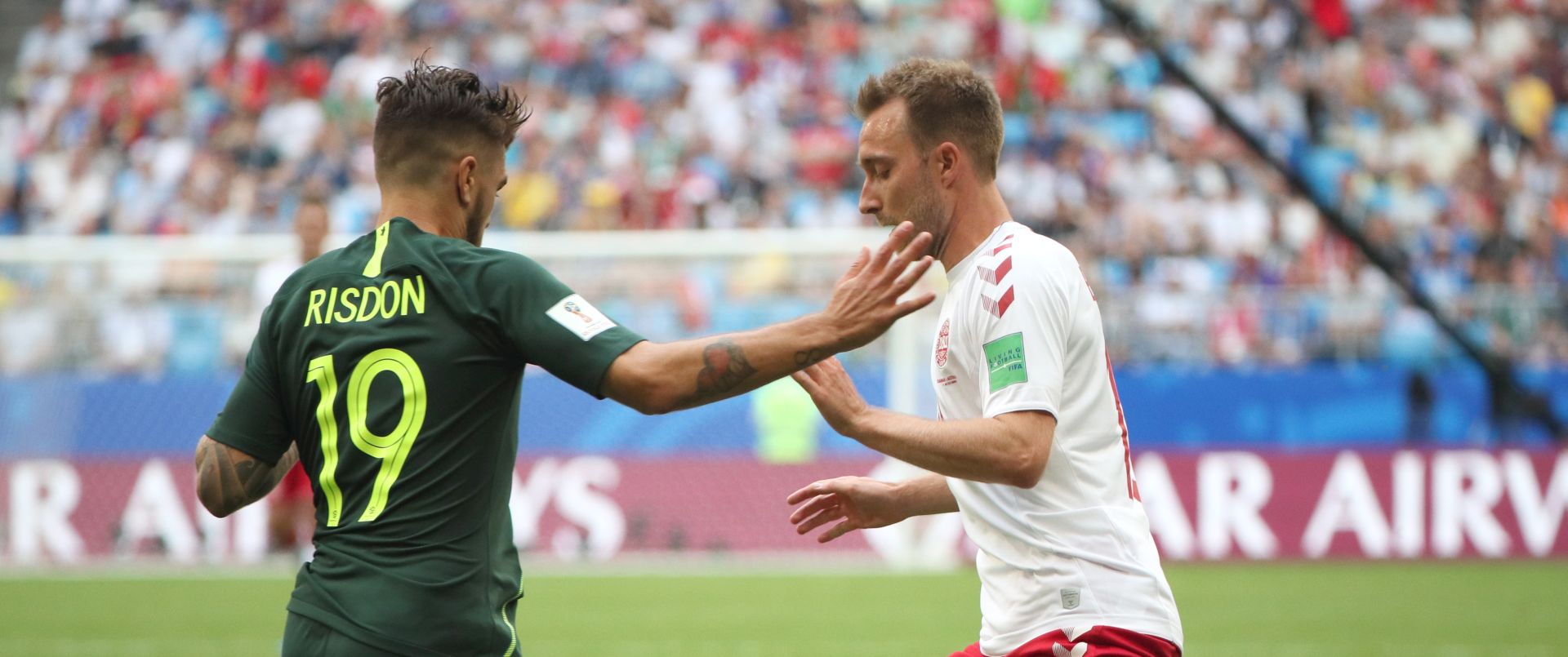 epa06827335 Joshua Rsidon (L) of Australia and Christian Eriksen of Denmark in action during the FIFA World Cup 2018 group C preliminary round soccer match between Denmark and Australia in Samara, Russia, 21 June 2018.

(RESTRICTIONS APPLY: Editorial Use Only, not used in association with any commercial entity - Images must not be used in any form of alert service or push service of any kind including via mobile alert services, downloads to mobile devices or MMS messaging - Images must appear as still images and must not emulate match action video footage - No alteration is made to, and no text or image is superimposed over, any published image which: (a) intentionally obscures or removes a sponsor identification image; or (b) adds or overlays the commercial identification of any third party which is not officially associated with the FIFA World Cup)  EPA/WALLACE WOON   EDITORIAL USE ONLY