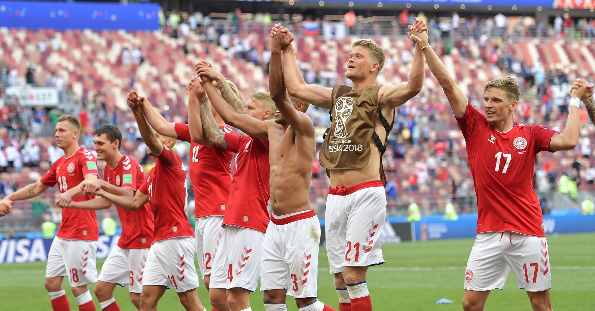 epa06842072 Danish players celebrate with supporters after the FIFA World Cup 2018 group C preliminary round soccer match between Denmark and France in Moscow, Russia, 26 June 2018. 

(RESTRICTIONS APPLY: Editorial Use Only, not used in association with any commercial entity - Images must not be used in any form of alert service or push service of any kind including via mobile alert services, downloads to mobile devices or MMS messaging - Images must appear as still images and must not emulate match action video footage - No alteration is made to, and no text or image is superimposed over, any published image which: (a) intentionally obscures or removes a sponsor identification image; or (b) adds or overlays the commercial identification of any third party which is not officially associated with the FIFA World Cup)  EPA/PETER POWELL   EDITORIAL USE ONLY