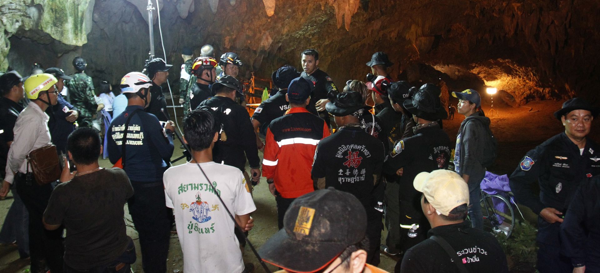 epa06840011 Thai rescue workers and associated officials plan a rescue operation for 12 football players and their coach who have gone missing and are believed to be trapped in cave, outside the Tham Luang cave, in the area of the Tham Luang Khun Nam Nang Noon Forest Park at Mae Sai district, Chiang Rai province, northern Thailand, late night on 25 June 2018. At least 12 members of a youth football team have gone missing and are believed to be trapped in cave of Mae Sai district. All of them have entered the cave after the players training on 23 June. They may have been cut off by rising flood water in the cave, the official said.  EPA/PONGMANAT TASIRI