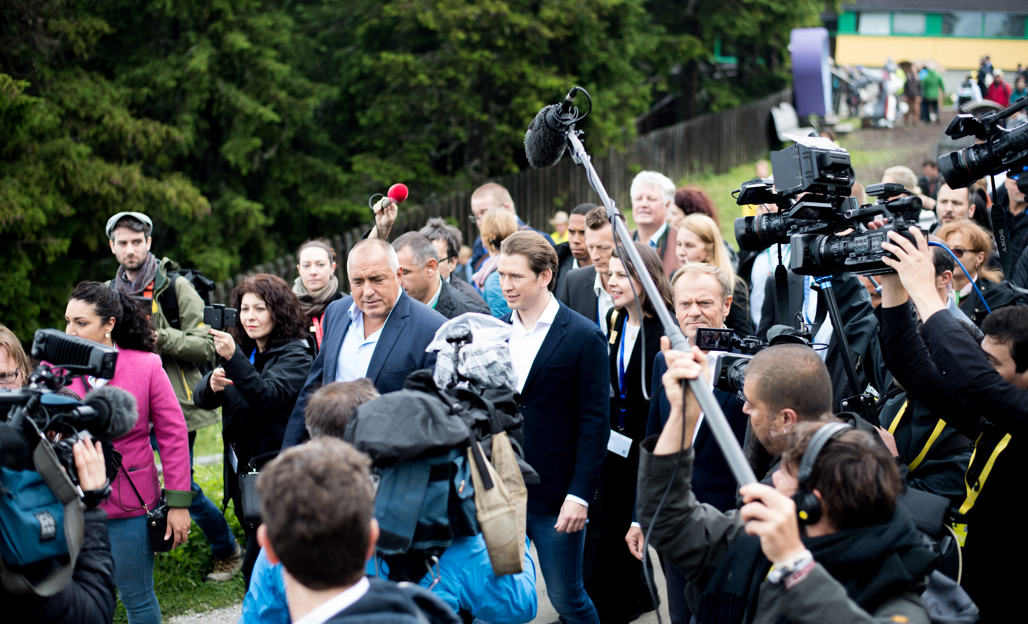epa06851523 Bulgarian Prime Minister Boyko Borissov (C-L), Austrian Chancellor Sebastian Kurz (C) and President of the European Council Donald Tusk (C-R) walking along the EU-Trail surrounded of journalists and spectators during the Inaugural event due to the Austrian presidency of the European Union in Schladming, Austria, 30 June 2018. Austria takes over the presidency of the European Union for the next six month.  EPA/MICHAEL GRUBER