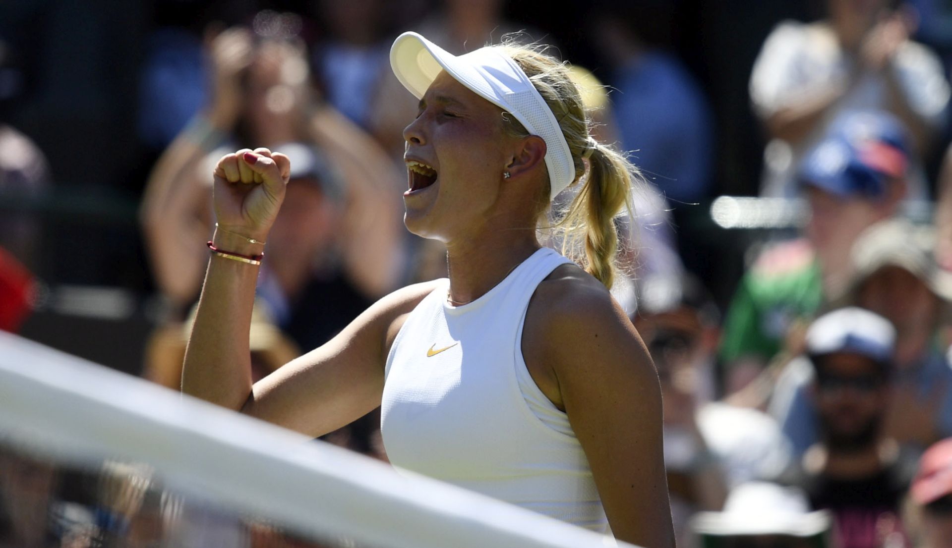 epa06857845 Donna Vekic of Croatia celebrates her match point winner against Sloane Stephens of USA in their first round match during the Wimbledon Championships at the All England Lawn Tennis Club, in London, Britain, 02 July 2018. EPA/NEIL HALL EDITORIAL USE ONLY/NO COMMERCIAL SALES