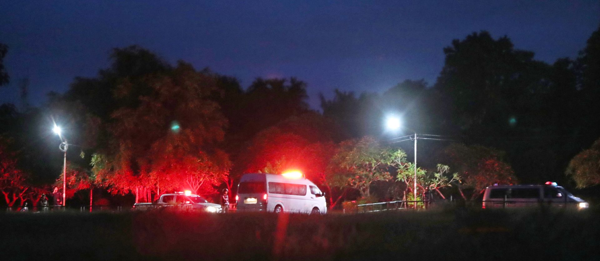 epa06873805 Ambulances transporting children to hospital after they have been rescue from Tham Luang cave, at a helicopter pad in Chiang Rai province, Thailand, 08 July 2018. Members of a children soccer team and their assistant coach who have been trapped in Tham Luang cave since 23 June 2018 have been rescued on 08 July 2018.  EPA/RUNGROJ YONGRIT