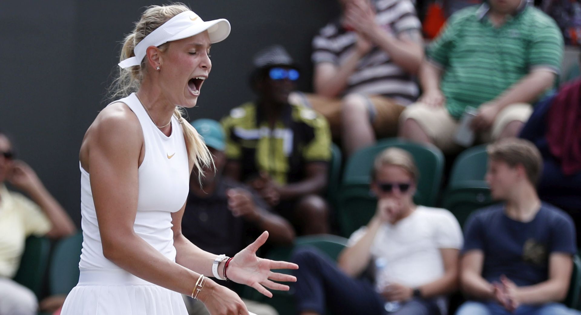 epa06875444 Donna Vekic of Croatia in action against Julia Goerges of Germany in their fourth round match during the Wimbledon Championships at the All England Lawn Tennis Club, in London, Britain, 09 July 2018. EPA/NIC BOTHMA EDITORIAL USE ONLY/NO COMMERCIAL SALES