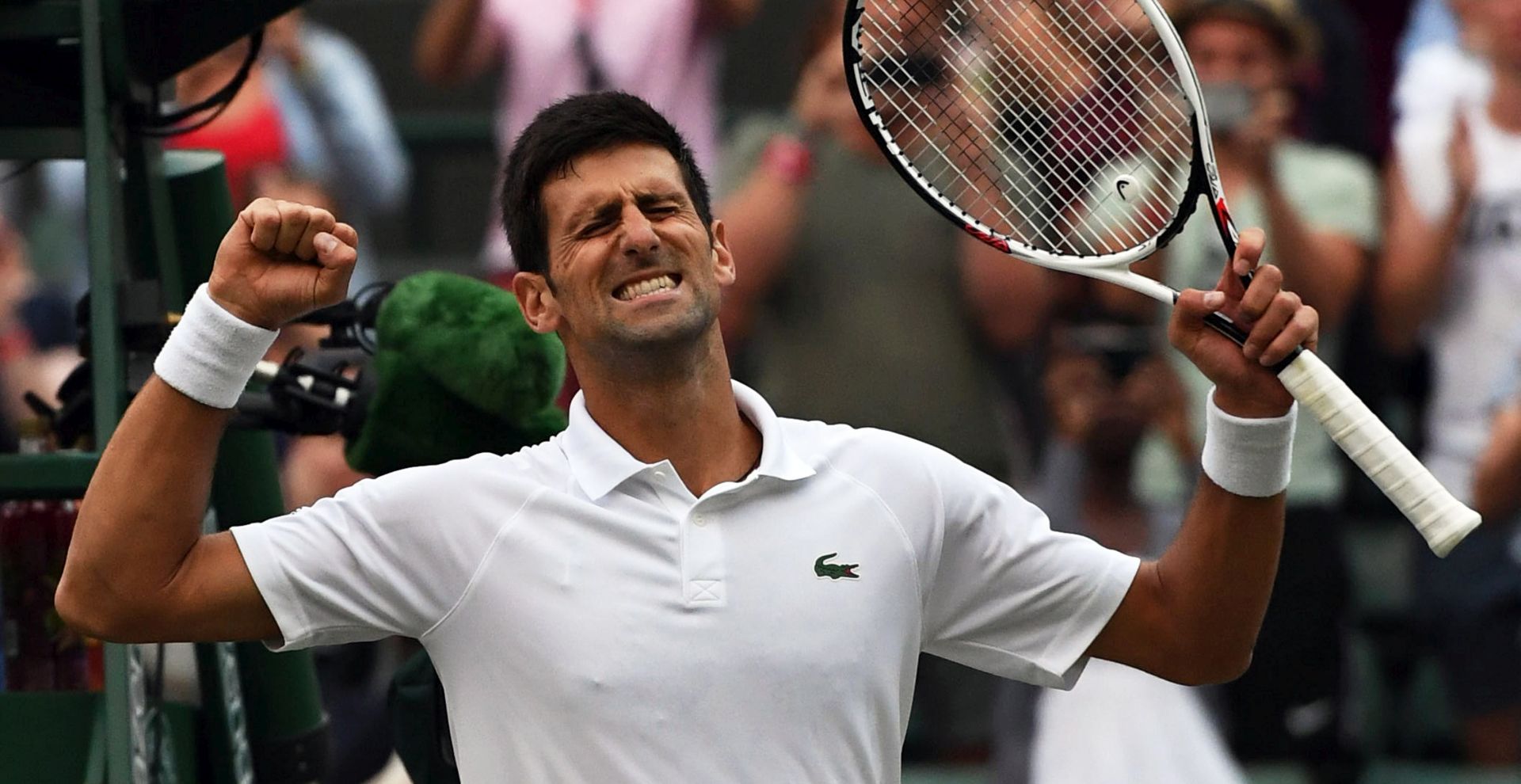 epa06876599 Novak Djokovic of Serbia celebrates his win over Karen Khachanov of Russia in their fourth round match during the Wimbledon Championships at the All England Lawn Tennis Club, in London, Britain, 09 July 2018. EPA/GERRY PENNY EDITORIAL USE ONLY/NO COMMERCIAL SALES
