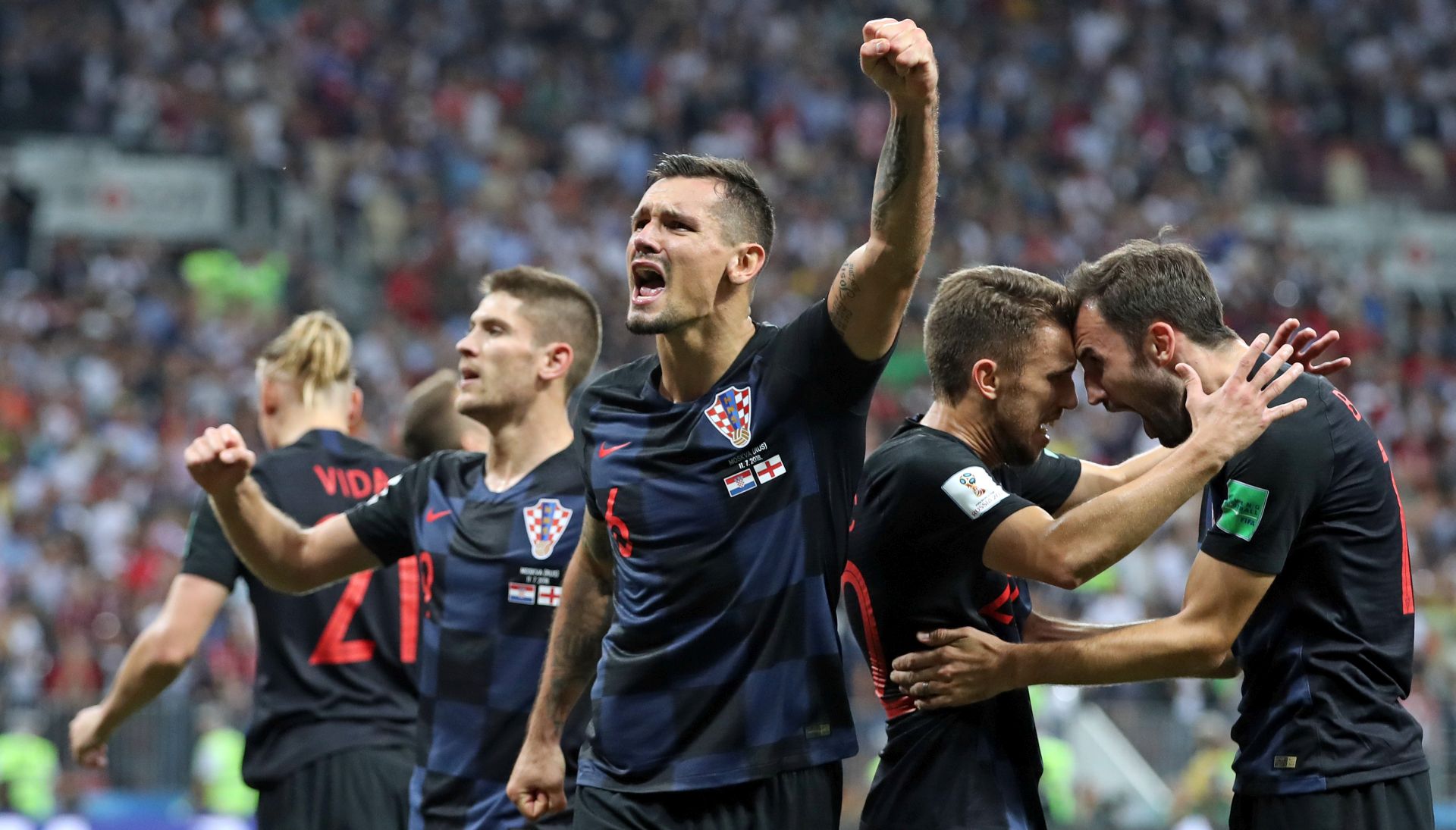 Moskva, 11.07.2018 - Nogometai Hrvatske plasirali su se u finale SP u Rusiji nakon to su u srijedu u Moskvi u polufinalnom susretu svladali Englesku sa 2-1 nakon produetaka, a pobjednièki gol zabio je Mario Mandukiæ u 109. minuti. Na slici Andrej Kramariæ, Dejan Lovren, Josip Pivariæ i Milan Badelj slave pobjedu.
foto HINA/ Damir SENÈAR /ds
