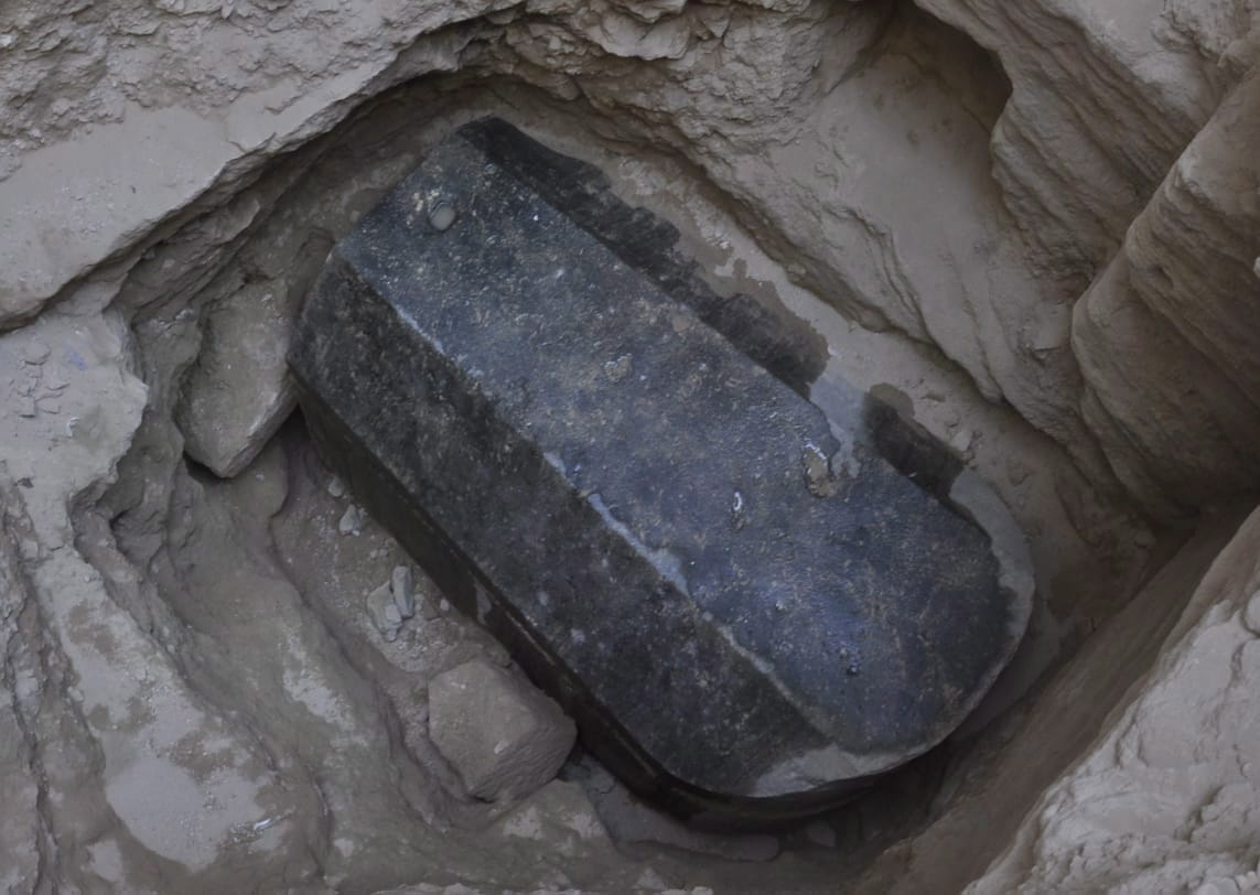 epa06883917 An undated handout photo made available by the Egyptian ministry of Antiquities shows the black granite sarcophagus at the disocvered tomb, Sidi Gaber district, Alexandria. An Egyptian archaeological mission found an ancient tomb dating to the Ptolemaic period (300-35 B.C), as they were inspecting the land before giving authorization for its owner to dig the foundations of a building. The tomb was found at the depth of five meters, a black granite sarcophagus was found, considered to be the largest to be discovered in Alexandria with the height of 185 cm, length 265 cm and width of 165 cm. A layer of mortar between the lid and the body of the sarcophagus indicating that it had not been opened since it was closed in antiquity.  EPA/EGYPTIAN MINISTRY OF ANTIQUITIES HANDOUT  HANDOUT EDITORIAL USE ONLY/NO SALES