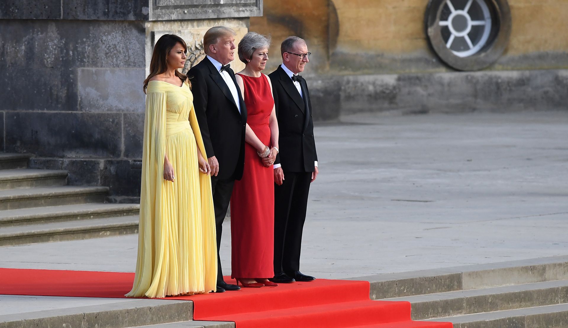 epa06884383 (L-R) Melania Trump, US President Donald J. Trump, British Prime Minister Theresa May and her husband Philip during a welcoming ceremony at Blenheim Palace, Oxfordshire, Britain, 12 July 2018. US President Trump is on a three-day working visit to the United Kingdom, first trip to the country as US president.  EPA/ANDY RAIN