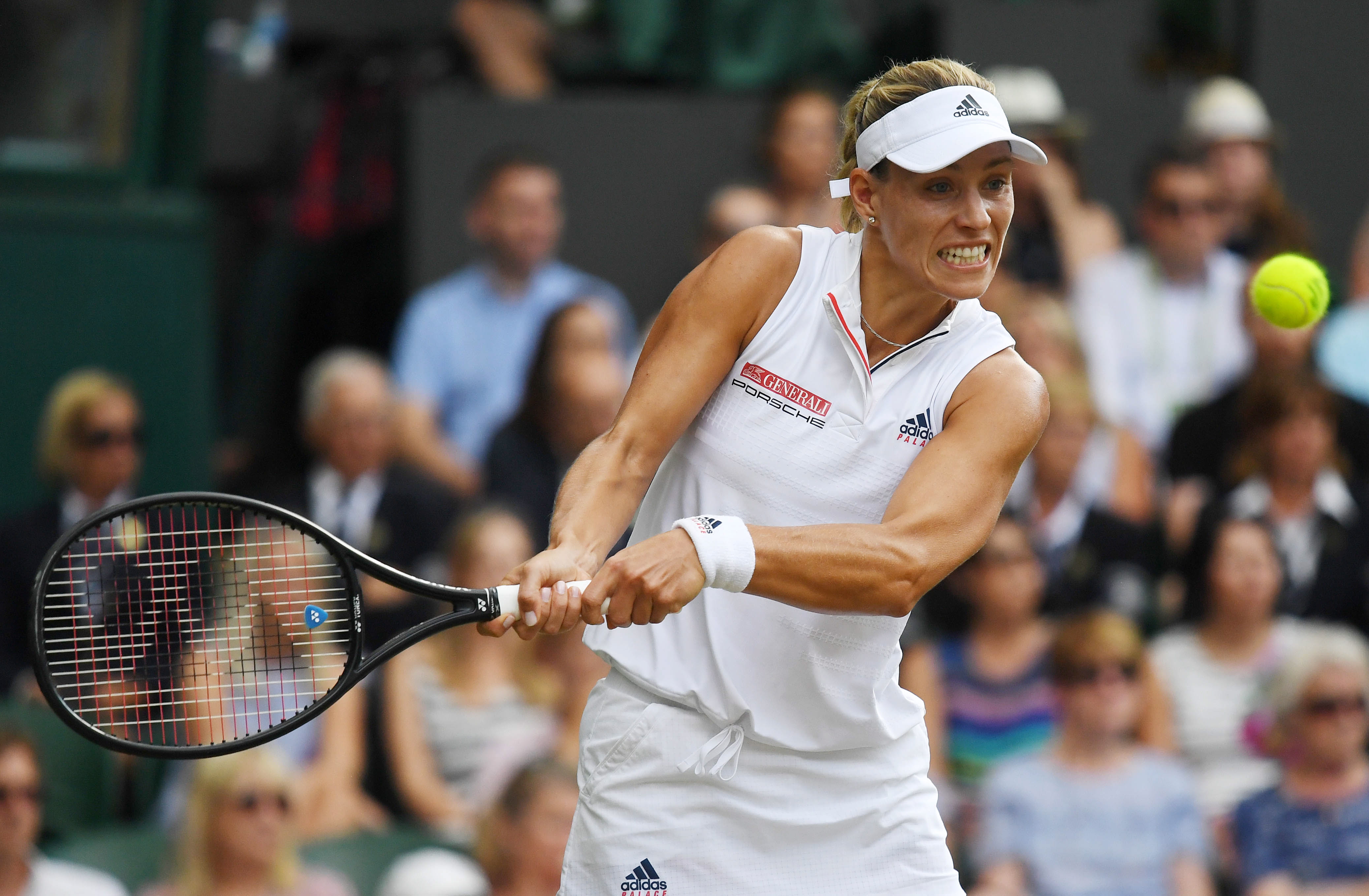 epa06888477 Angelique Kerber of Germany returns to Serena Williams of the US during their  Womans Final match at the Wimbledon Championships at the All England Lawn Tennis Club, in London, Britain, 14 July 2018.  EPA/NEIL HALL EDITORIAL USE ONLY/NO COMMERCIAL SALES