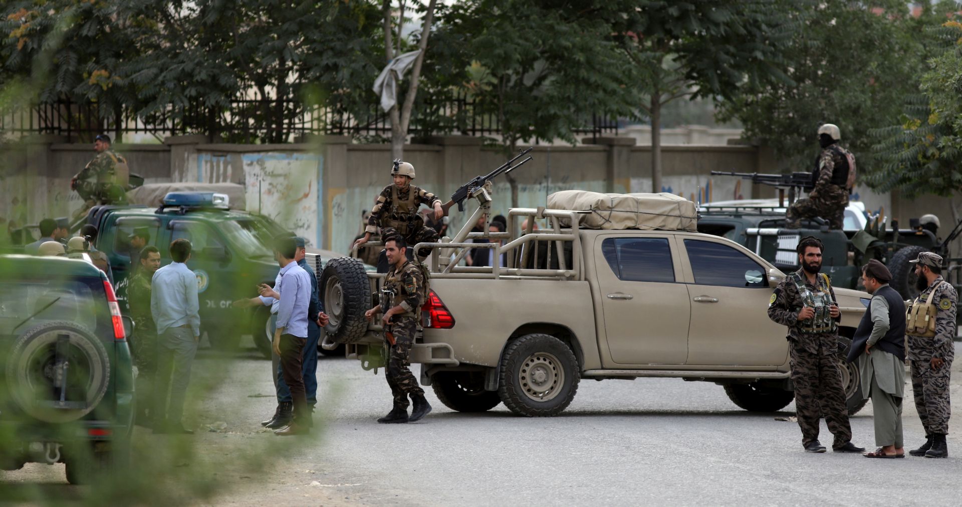 epa06890311 Afghan security officers secure the scene of a suicide attack near the Ministry of Rural Rehabilitation in Kabul, Afghanistan, 15 July 2018. According to police officials, at least seven people were killed and 10 others were injured.  EPA/JAWAD JALALI