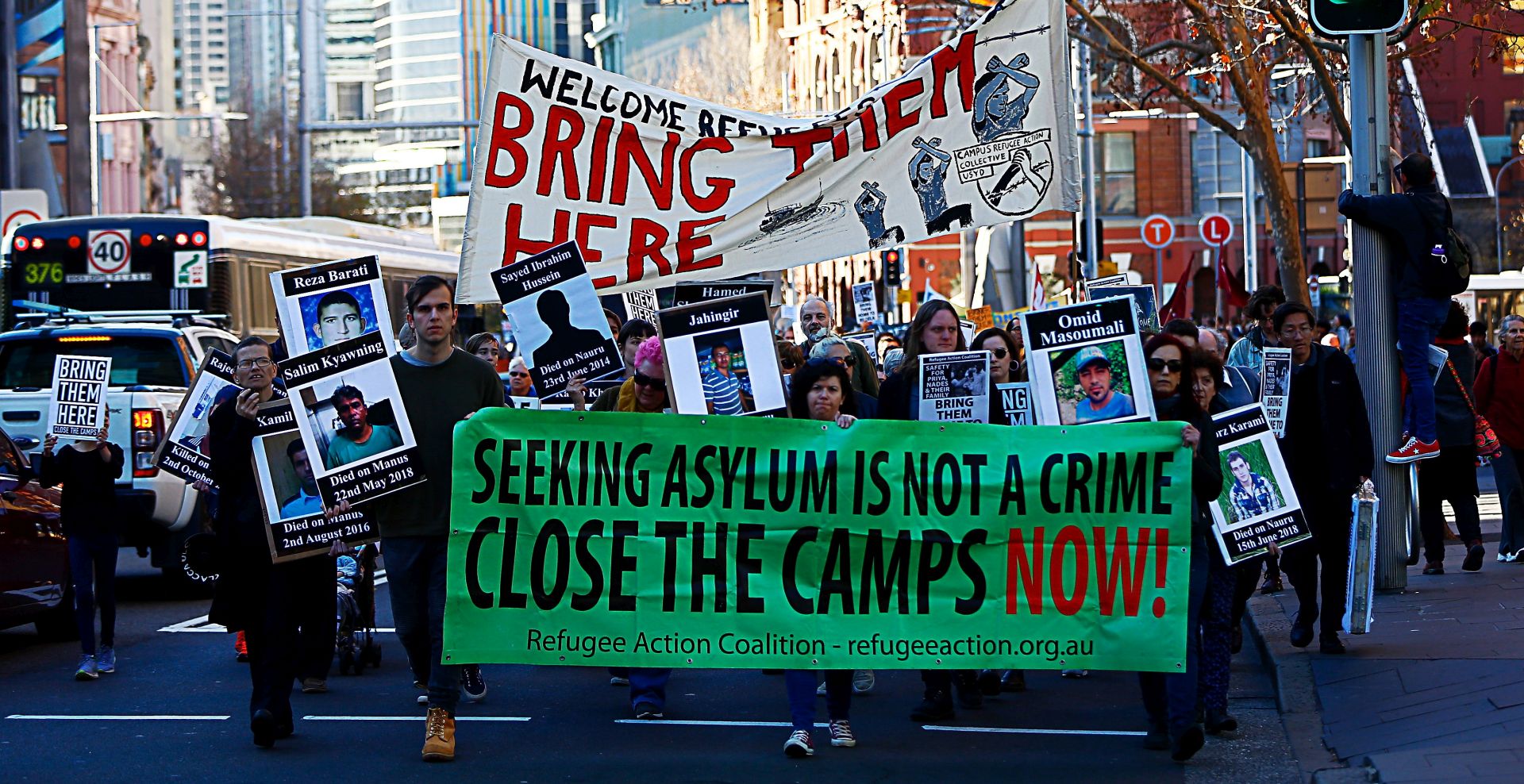epa06901820 Protesters are seen during the Evacuate Manus and Nauru Protest - 'Five Years Too Long, 12 Deaths Too Many' Protest at Town Hall in Sydney, Australia, 21 July 2018. Refugee Action Coalition (RAC) Sydney organised a protest against mandatory offshore detention.  EPA/JEREMY NG AUSTRALIA AND NEW ZEALAND OUT