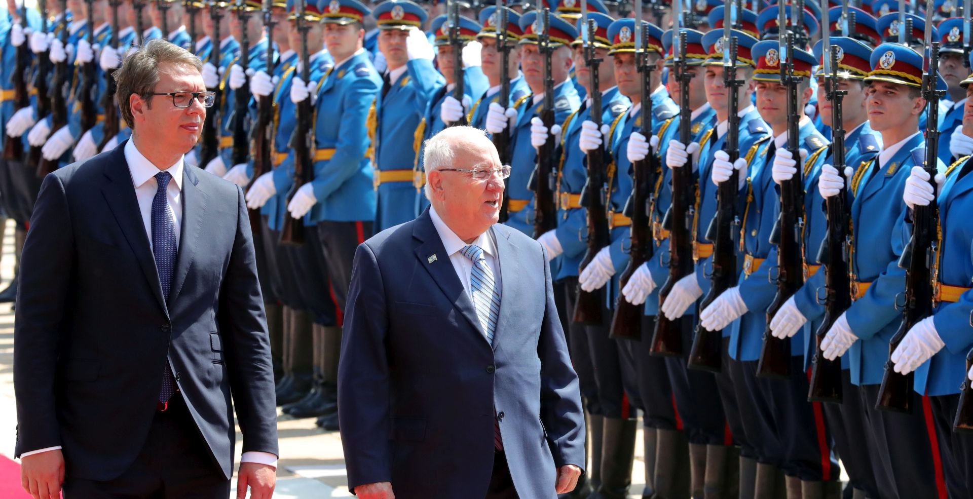 epa06911173 Israeli President Reuven Rivlin (L) and Serbian President Aleksandar Vucic (R) inspect a guard of honor during a welcome ceremony in Belgrade, Serbia, 26 July 2018. President Rivlin is on a one-day official visit to the Serbian capital.  EPA/KOCA SULEJMANOVIC