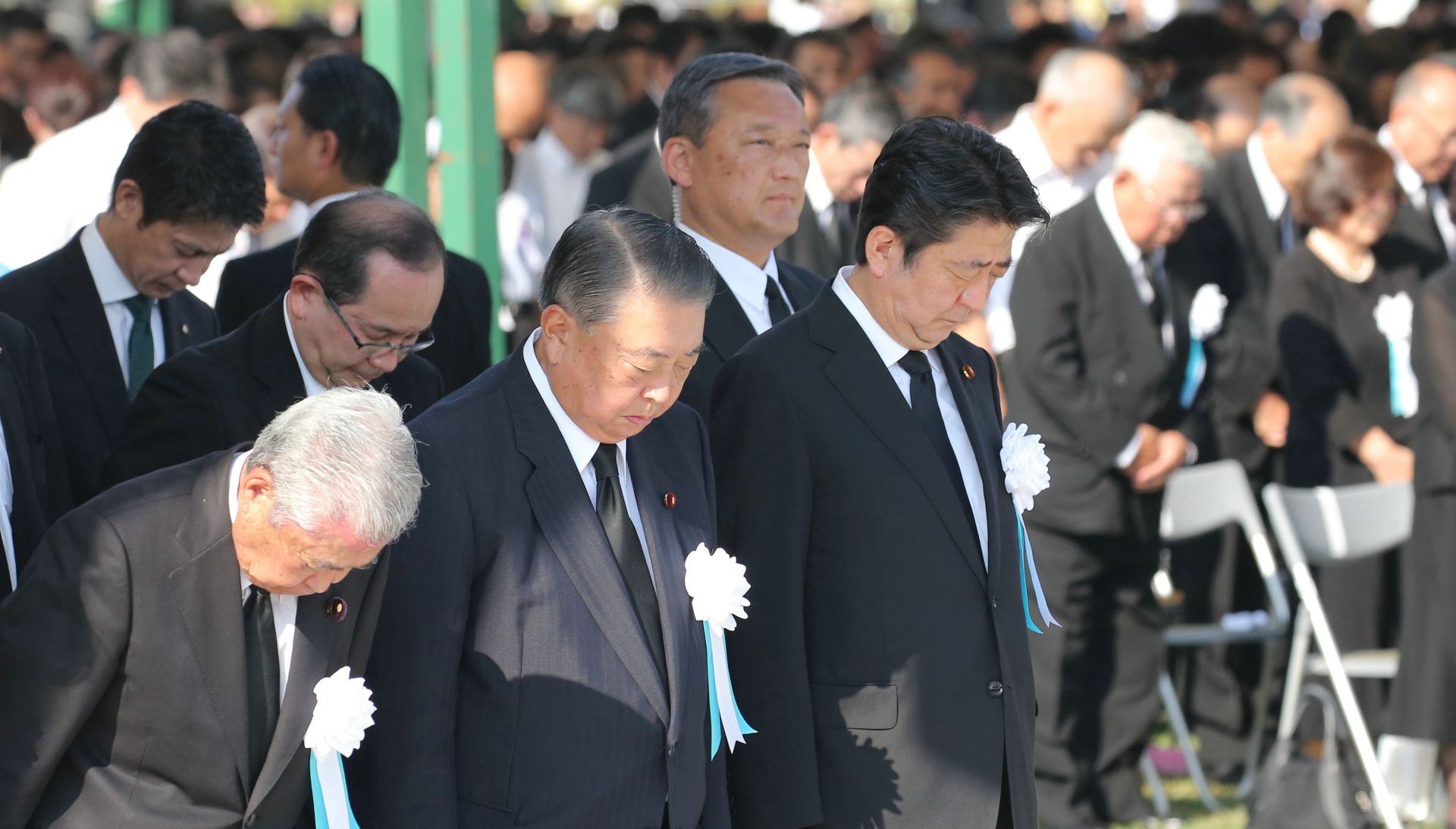 epa06930067 Japanese Prime Minister Shinzo Abe (R) and officials offer a minute of silent prayers for victims of the 06 August 1945 atomic bombing during a memorial ceremony at the Hiroshima Peace Memorial Park in Hiroshima, Japan, 06 August 2018. Hiroshima marked the 73rd anniversary of the atomic bombing.  EPA/JIJI PRESS JAPAN OUT EDITORIAL USE ONLY/  NO ARCHIVES