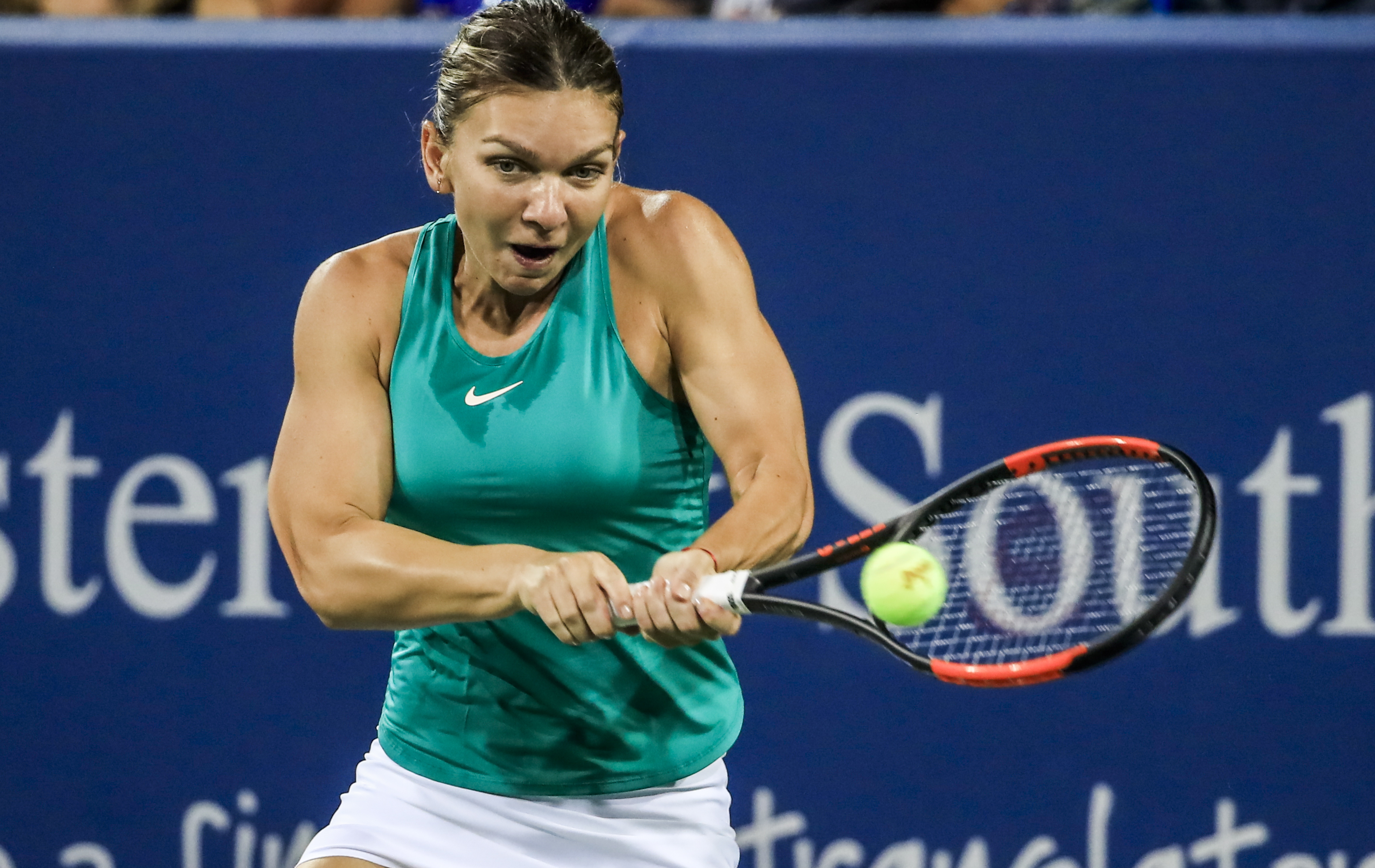 epa06952008 Simona Halep of Romania in action against Ajla Tomljanovic of Australia during their match in the Western & Southern Open tennis tournament at the Lindner Family Tennis Center in Mason, Ohio, USA, 15 August 2018.  EPA/TANNEN MAURY