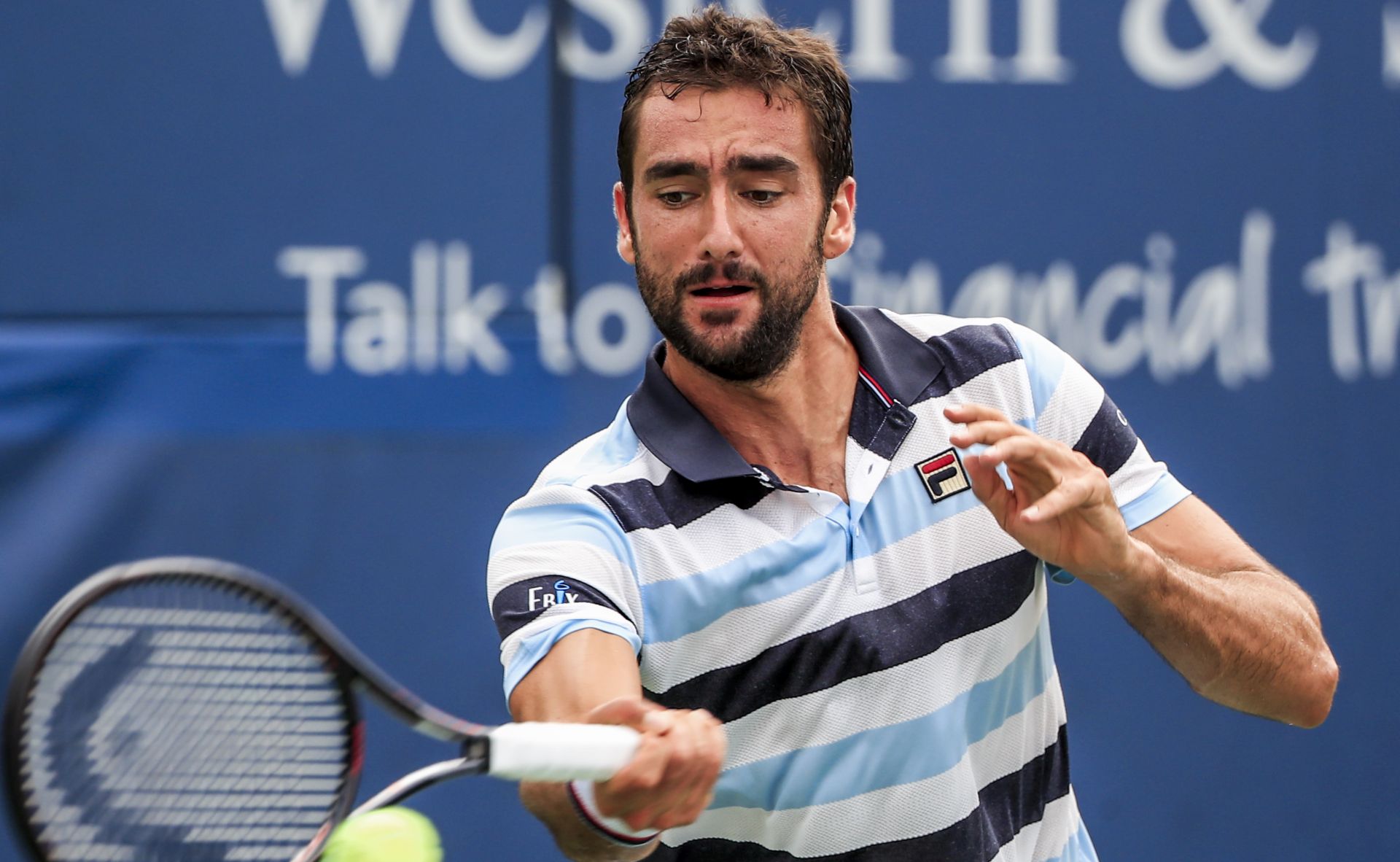 epa06955125 Marin Cilic of Croatia in action against Pablo Carreno Busta of Spain in their match in the Western & Southern Open tennis tournament at the Lindner Family Tennis Center in Mason, Ohio, USA, 17 August 2018.  EPA/TANNEN MAURY