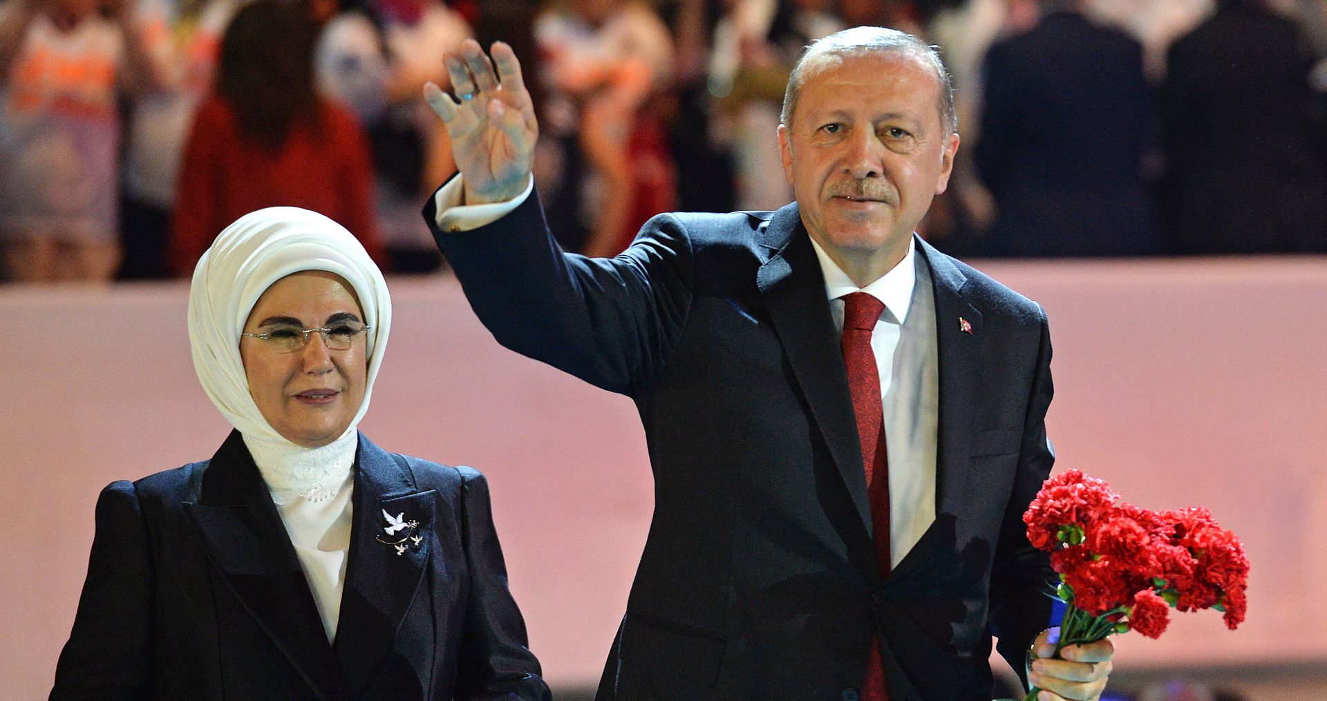 epa06955611 Turkish President Recep Tayyip Erdogan (R) and his wife Emine Erdogan (L) greeting to supporters of the ruling Justice and Development Party (AKP) during an ordinary party congress of the Justice and Development Party (AKP) in Ankara, Turkey, 18 August 2018. Turkey’s ruling AKP holds its sixth regular grand congress.  EPA/STR