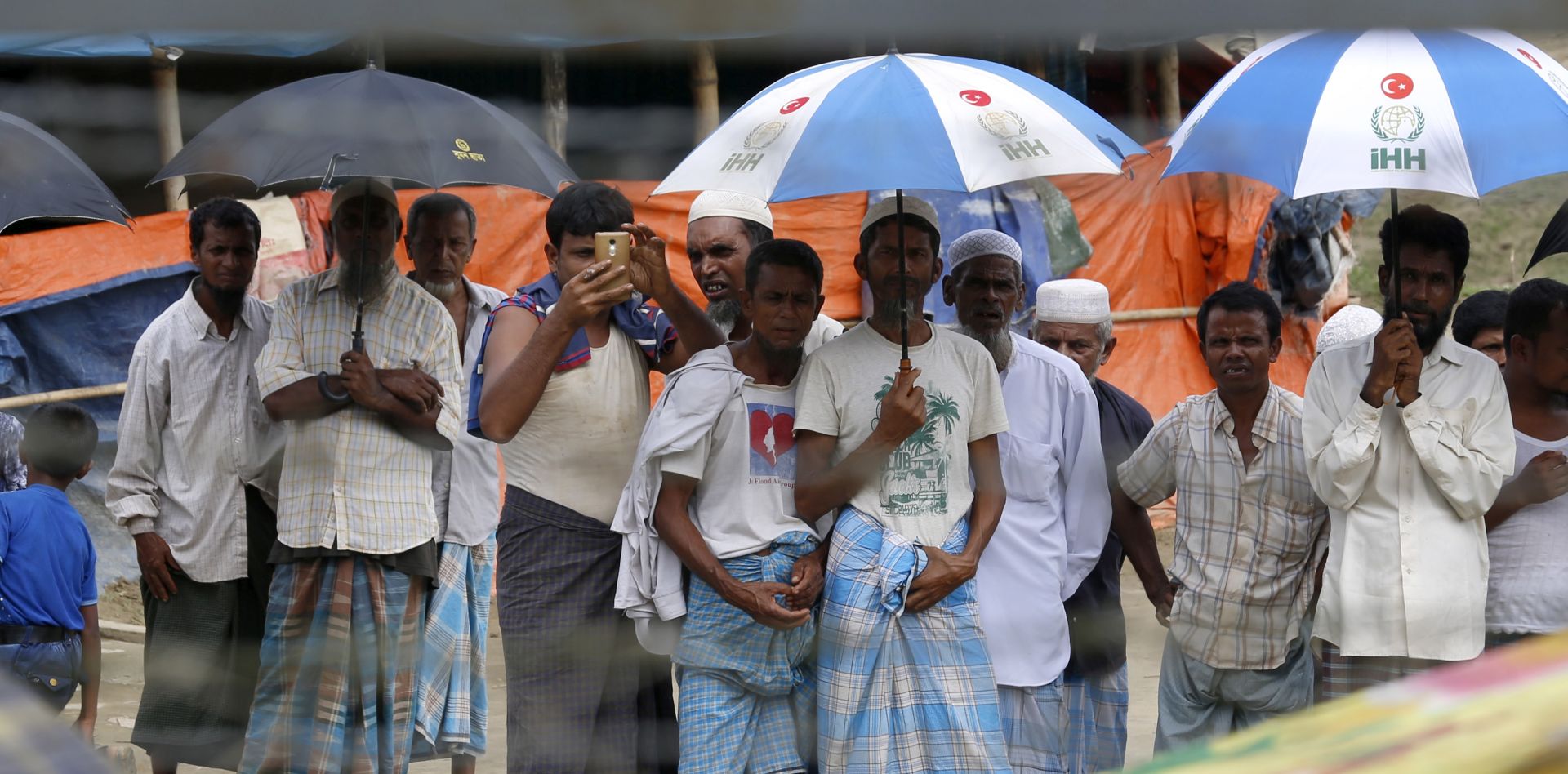 epa06969131 Rohingyas refugees gather near the fence at the 'no man's land' zone between the Bangladesh-Myanmar border in Maungdaw district, Rakhine State, western Myanmar, 24 August 2018. The Rohingya crisis started in August 2017, when Rohingya militants launched a series of attacks on multiple Myanmar government posts in the region, leading the army to unleash a large military campaign that drove around 700,000 Rohingyas across the border and declaration of the Arakan Rohingya Salvation Army (ARSA), a Rohingya insurgent group active in northern Rakhine State, as a terrorist group on 25 August 2017 by the Myanmar Central Committee for Counter Terrorism.  EPA/NYEIN CHAN NAING