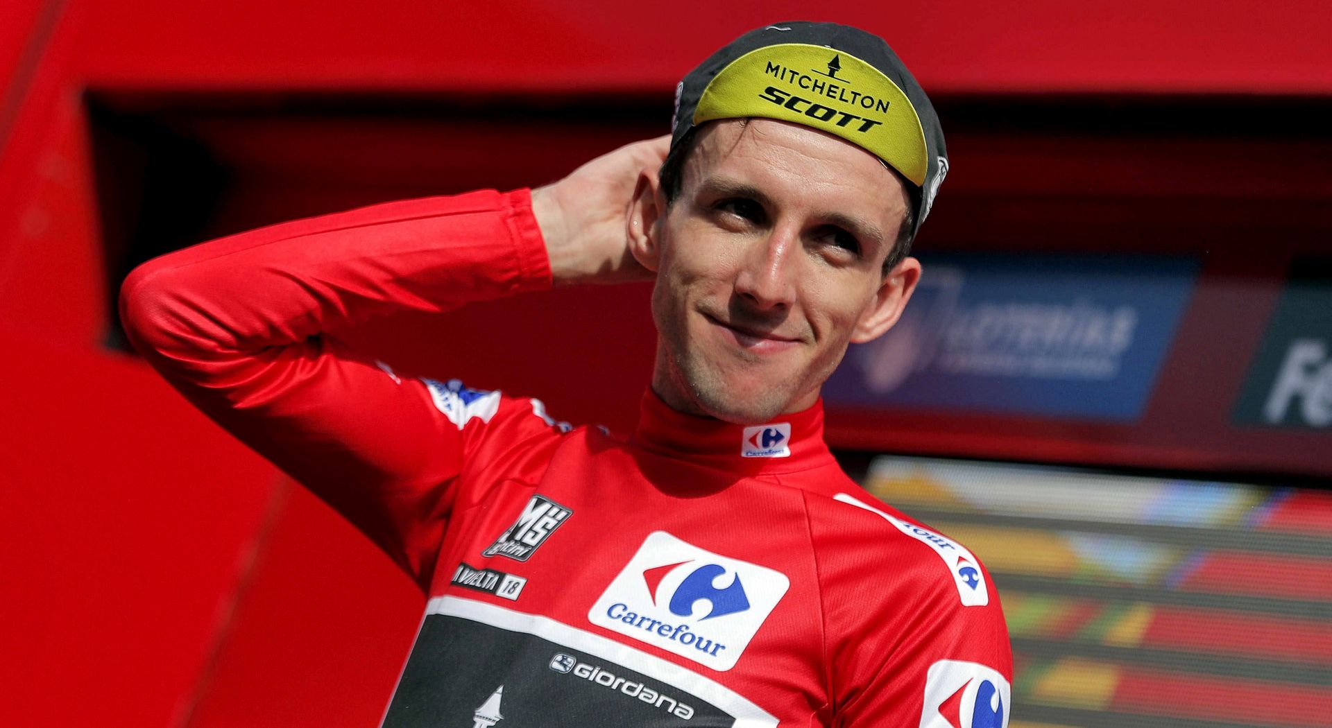 epa06999077 British cyclist Simon Yates of Michelton-Scott team retains the overall leader's red jersey after the 11th stage of La Vuelta cycling tour over 207km from Mombuey to Luintra, Spain, 05 September 2018.  EPA/MANUEL BRUQUE
