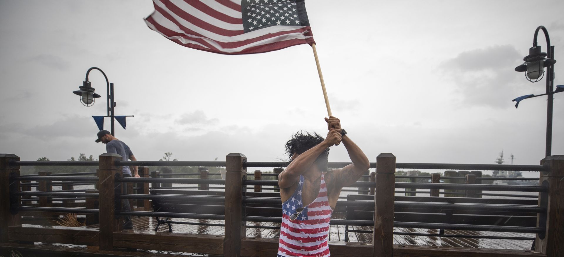 epa07018418 Jeff Egyp marches along the Cape Fear River as Hurricane Florence hits Wilmington, North Carolina USA, 13 September 2018. Hurricane Florence has been downgraded to a category 2 storm on the Saffir-Simpson Hurricane Wind Scale, though is still expected to bring a storm surge with heavy flooding to the Carolinas.  EPA/JIM LO SCALZO