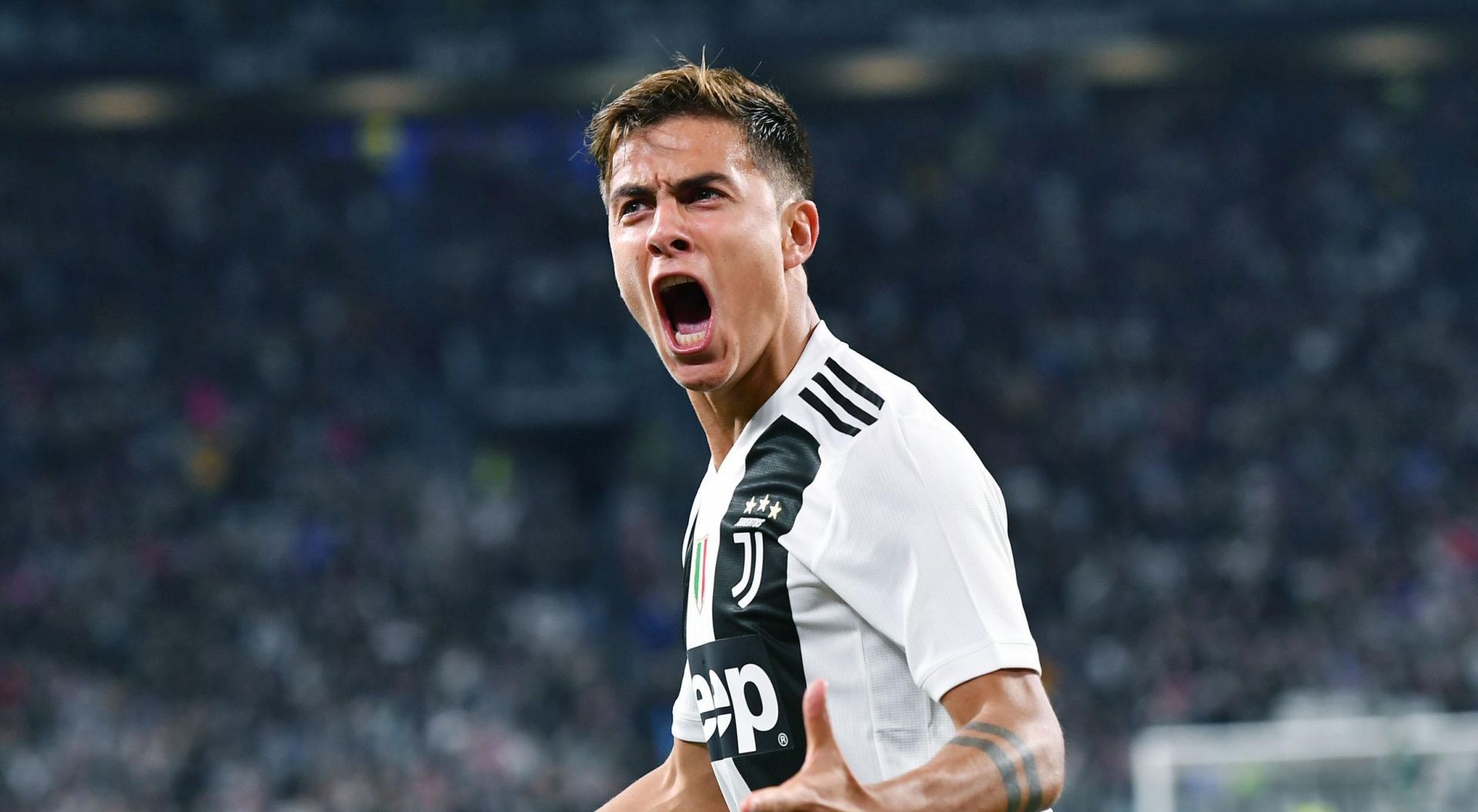 epa07049337 Juventus's Paulo Dybala celebrates after scoring a goal during the Italian Serie A soccer match between Juventus FC vs Bologna FC at Allianz Stadium in Turin, Italy, 26 September 2018.  EPA/DI MARCO
