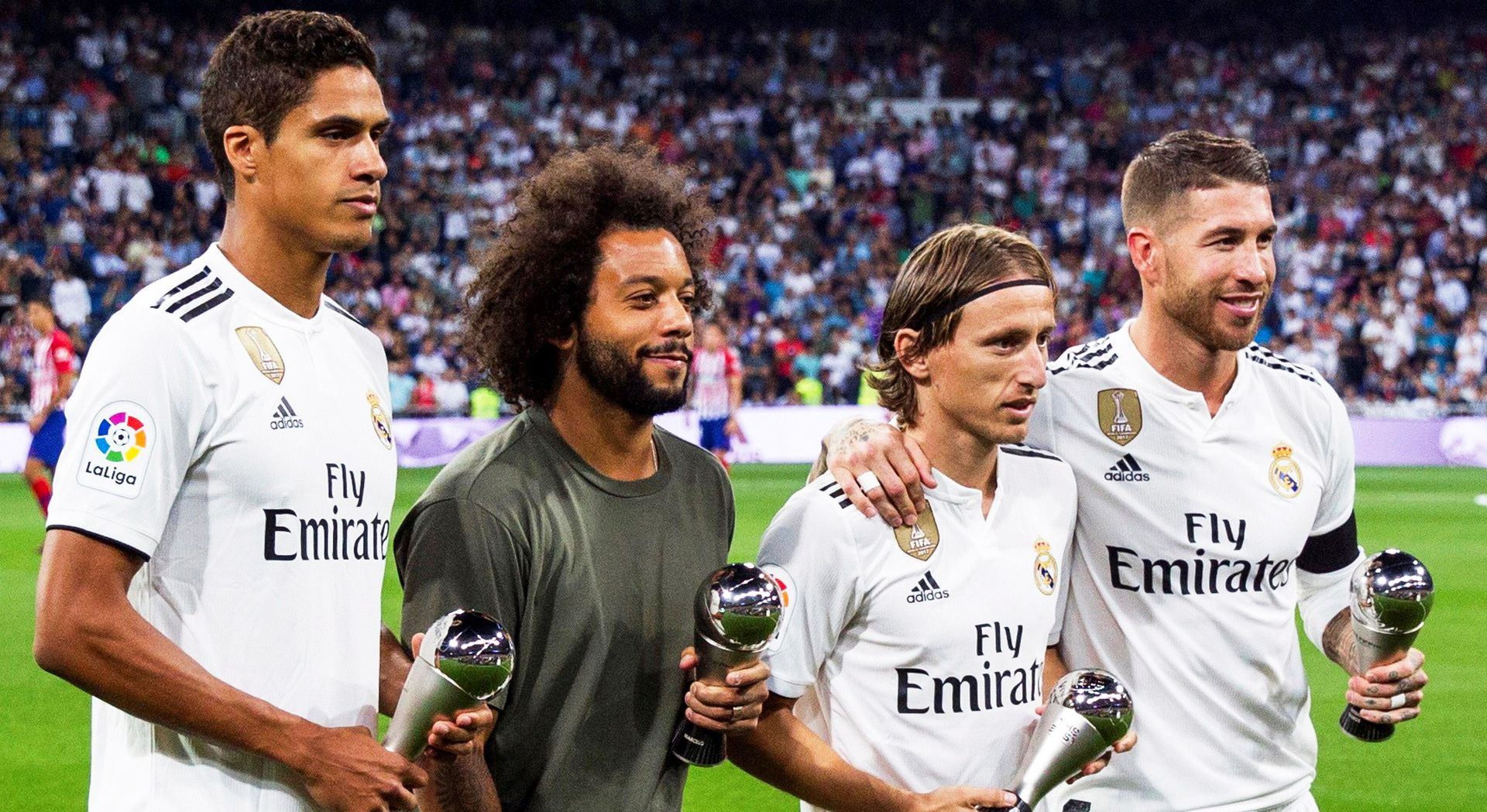 epa07057457 Real Madrid players (L-R) Raphael Varane, Marcelo, Luka Modric, and Sergio Ramos pose with their Best FIFA Football Awards trophies before the Spanish La Liga soccer match between Real Madrid and Atletico Madrid in Madrid, Spain, 29 September 2018.  EPA/RODRIGO JIMENEZ