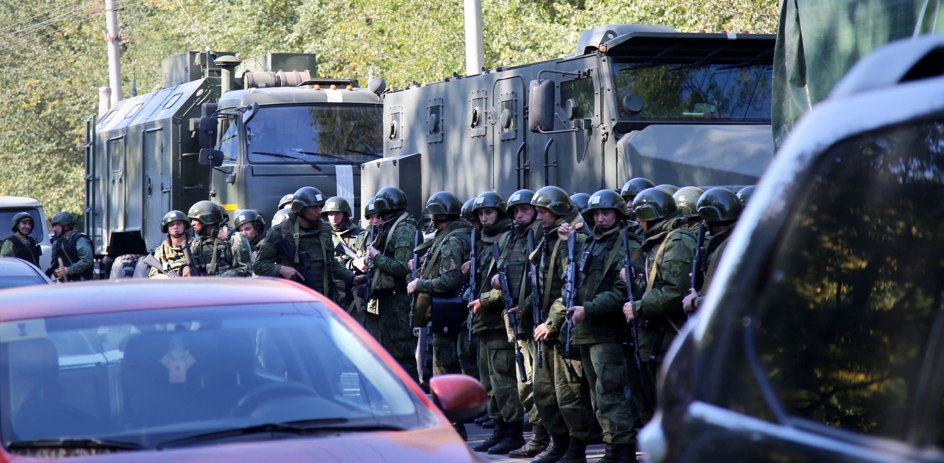 epa07099787 Military forces block the road to the site of attack at a vocational school  in Kerch in Crimea, 17 October 2018. According to reports, at least 18 people were killed and some 40 injured in a suspected explosion and shooting in the school. According to the Russian Investigative Committee, an 18-year-old student has committed suicide after allegedly attacking the school.  EPA/KERCH.FM