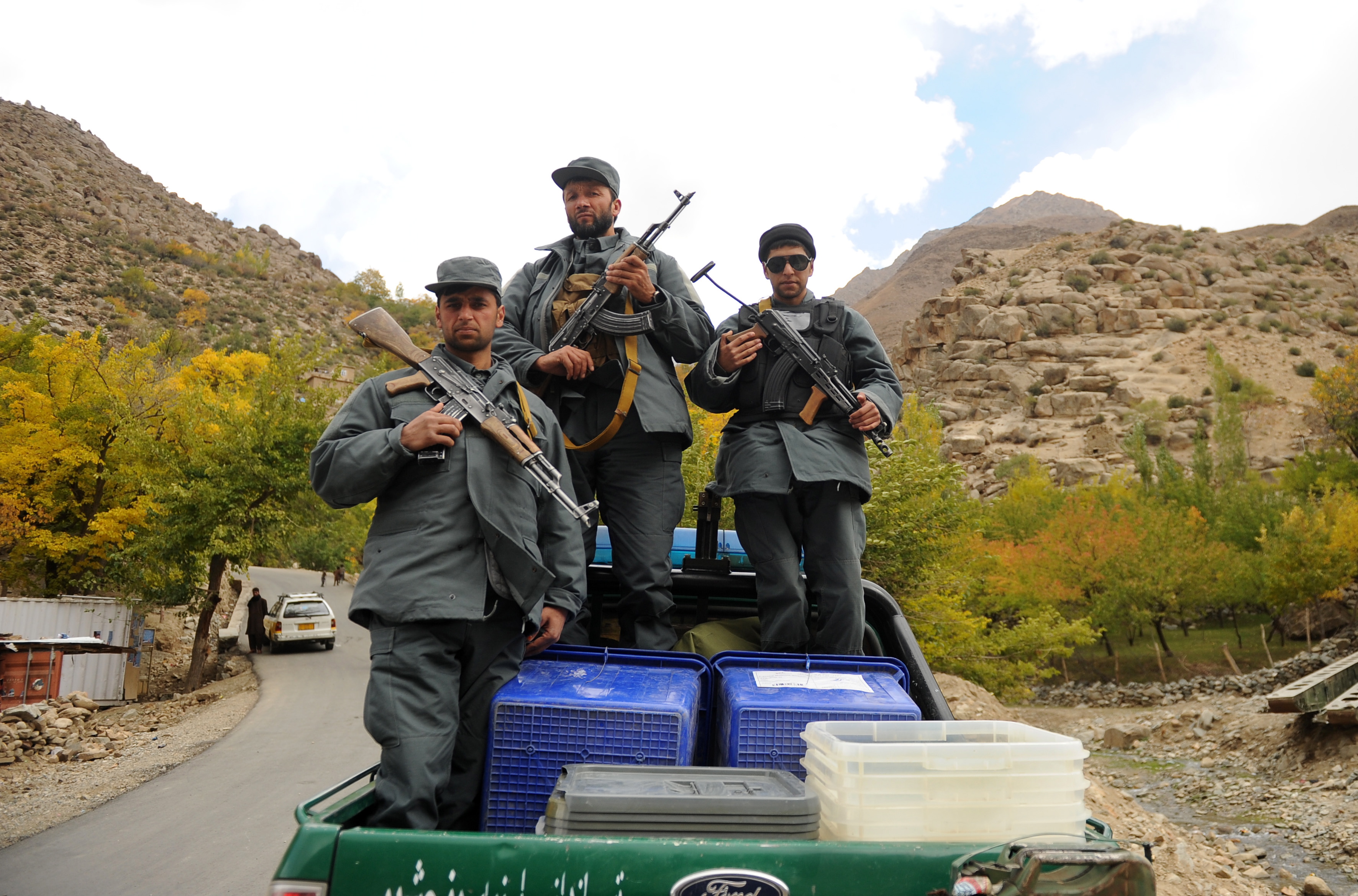 epa07105381 Afghan soldiers escort ballot boxes loaded on a police vehicle close to Abdullah Khil valley in northern province Panjsher, Afghanistan, 19 October 2018. According to the Independent Election Commission (IEC) around 2,565 candidates are battling in elections scheduled for 20 October for the 249 seats in Wolesi Jirga (Lower House of the Parliament), including 417 female candidates.  EPA/HEDAYATULLAH AMID
