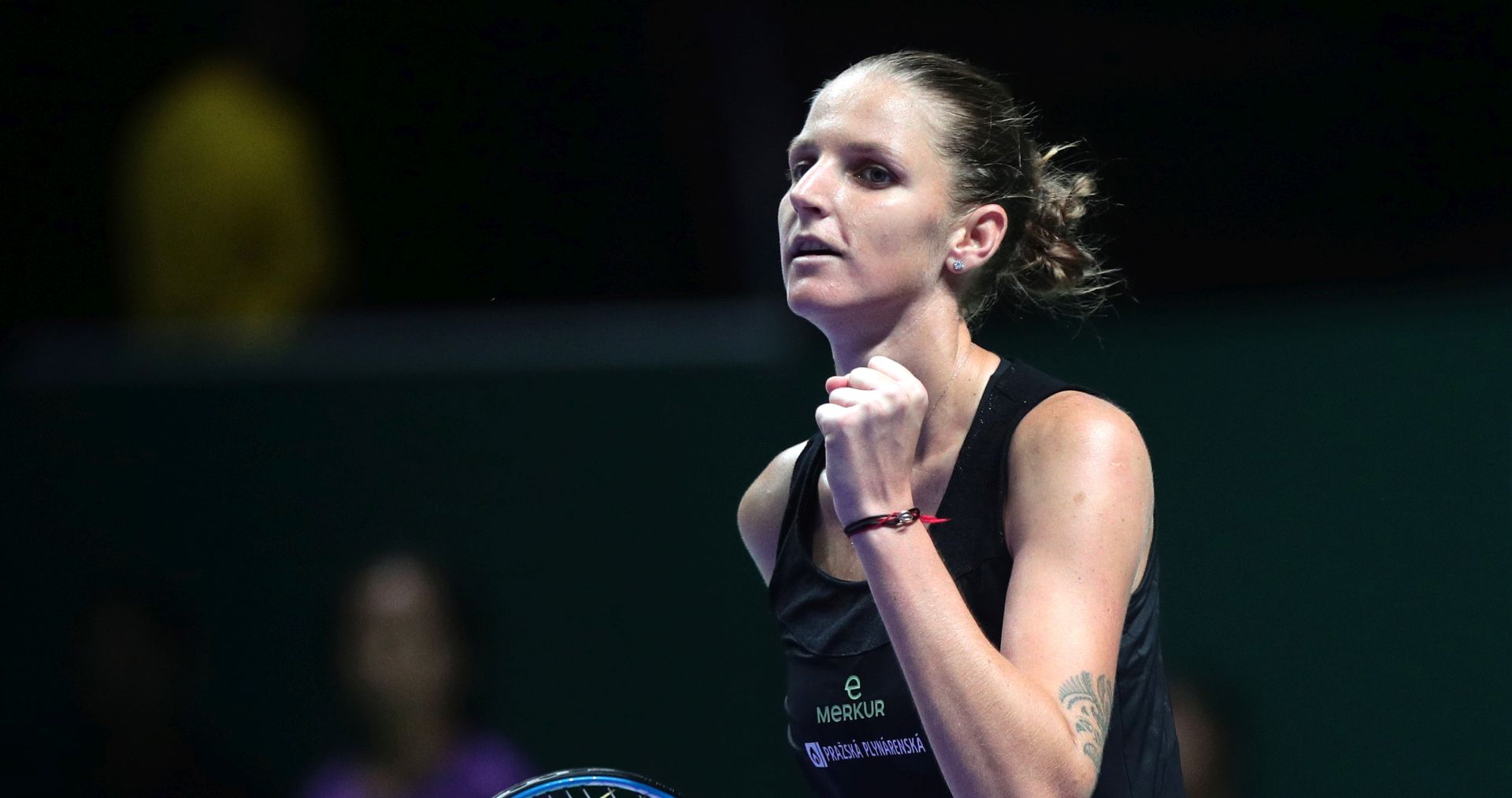 epa07109281 Karolina Pliskova of the Czech Republic reacts  after winning against Caroline Wozniacki of Denmark during their singles round robin match of the BNP Paribas WTA Finals 2018 held at the Indoor Stadium in Singapore, 21 October 2018.  EPA/WALLACE WOON