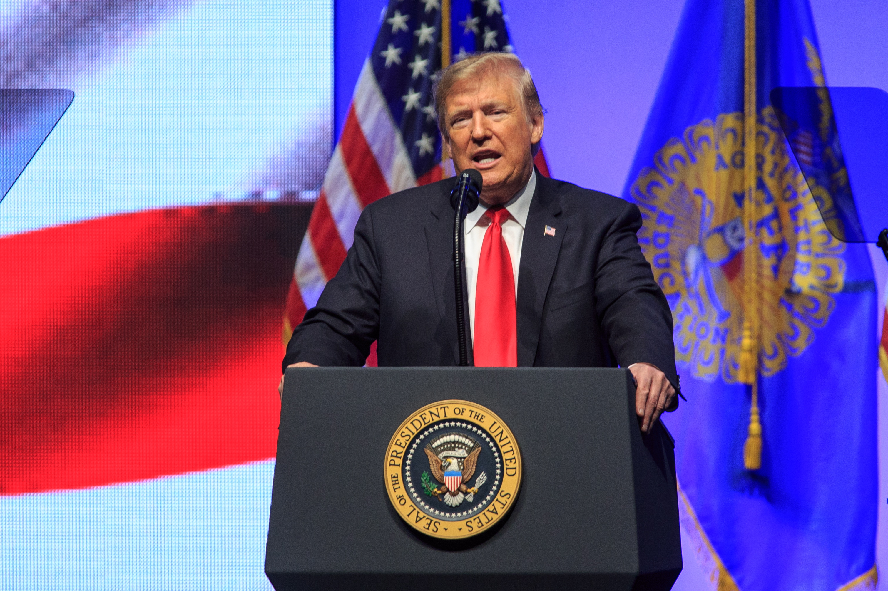 epa07125184 US President Donald J. Trump speaks to the Future Farmers of America convention at the Banker's Life Fieldhouse in Indianapolis, Indiana, USA, 27 October 2018. Trump has been criss-crossing the country holding rallies ahead of the Mid-Term elections scheduled for 06 November.  EPA/JUSTIN CASTERLINE