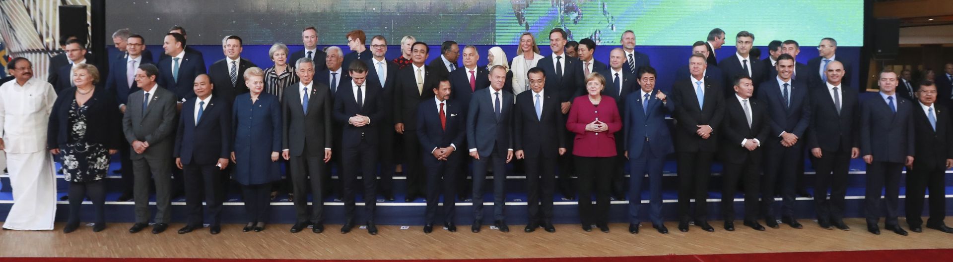epa07104358 Leaders pose during a family picture during the 12th Asem, Asia-Europe Meeting in Brussels, Belgium, 19 October 2018. Heads of state and governments from 51 European and Asian countries will discuss on the theme 'Europe and Asia: global partners for global challenges'.  EPA/STEPHANIE LECOCQ