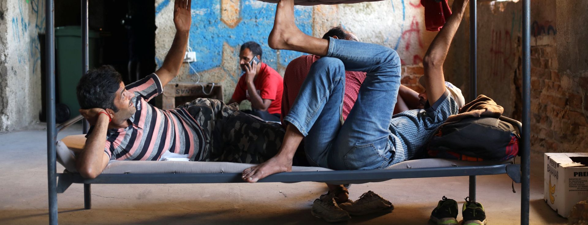 Migrants rest in a dorm destroyed during the Bosnian 1992-1995 war, in Bihac Migrants rest in a dorm destroyed during the Bosnian 1992-1995 war, in Bihac, Bosnia and Herzegovina August 21, 2018. Picture taken August 21, 2018. REUTERS/Igor Pavicevic NO RESALES. NO ARCHIVES STRINGER