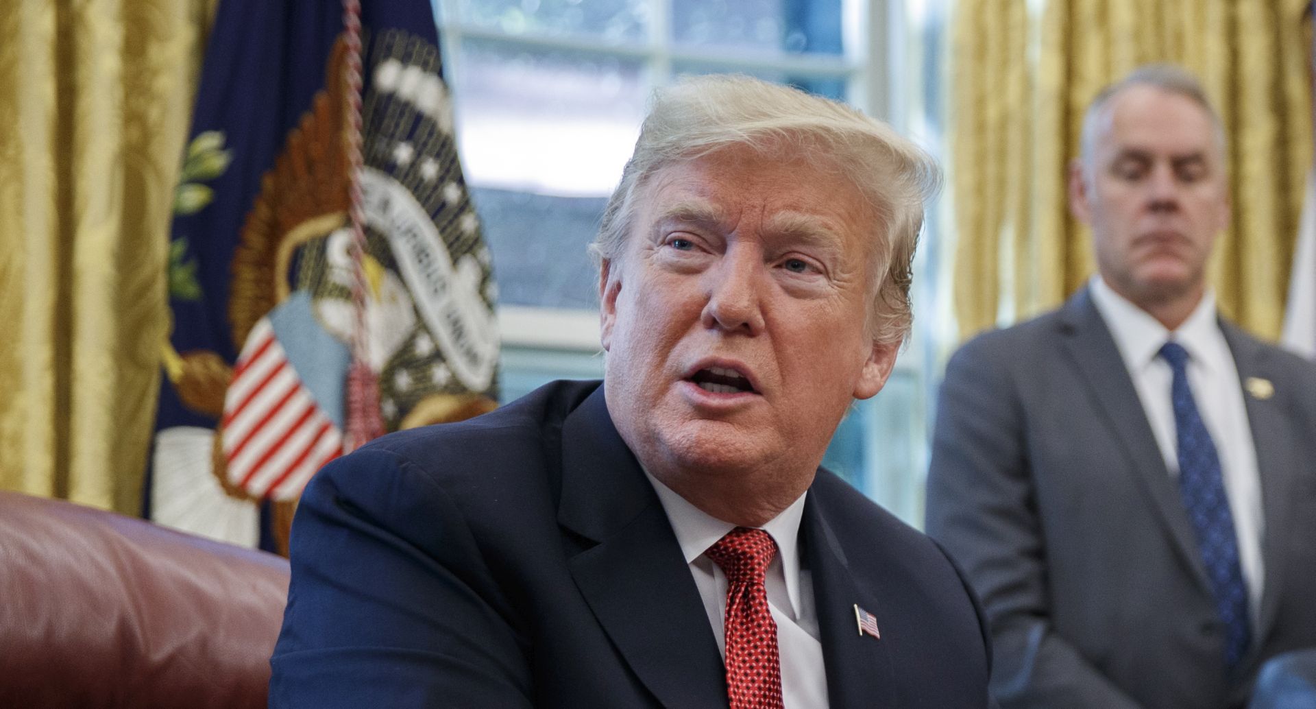epa07100796 US President Donald J. Trump delivers remarks during a meeting with workers on 'Cutting the Red Tape, Unleashing Economic Freedom' in the Oval Office of the White House in Washington, DC, USA, 17 October 2018.  EPA/SHAWN THEW