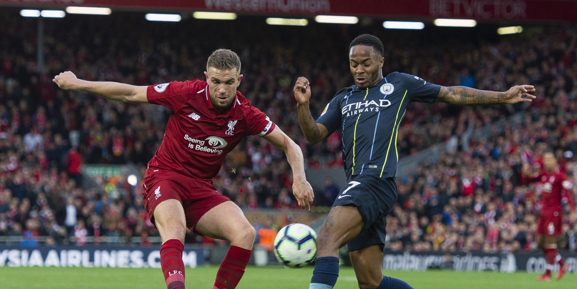 epa07077253 Liverpool's Jordan Henderson (L) in action with Manchester City's Raheem Sterling (R)  during the English Premier League soccer match between Liverpool  and Manchester City at Anfield, Liverpool, Britain, 07 October 2018.  EPA/PETER POWELL EDITORIAL USE ONLY. No use with unauthorized audio, video, data, fixture lists, club/league logos or 'live' services. Online in-match use limited to 75 images, no video emulation. No use in betting, games or single club/league/player publications
