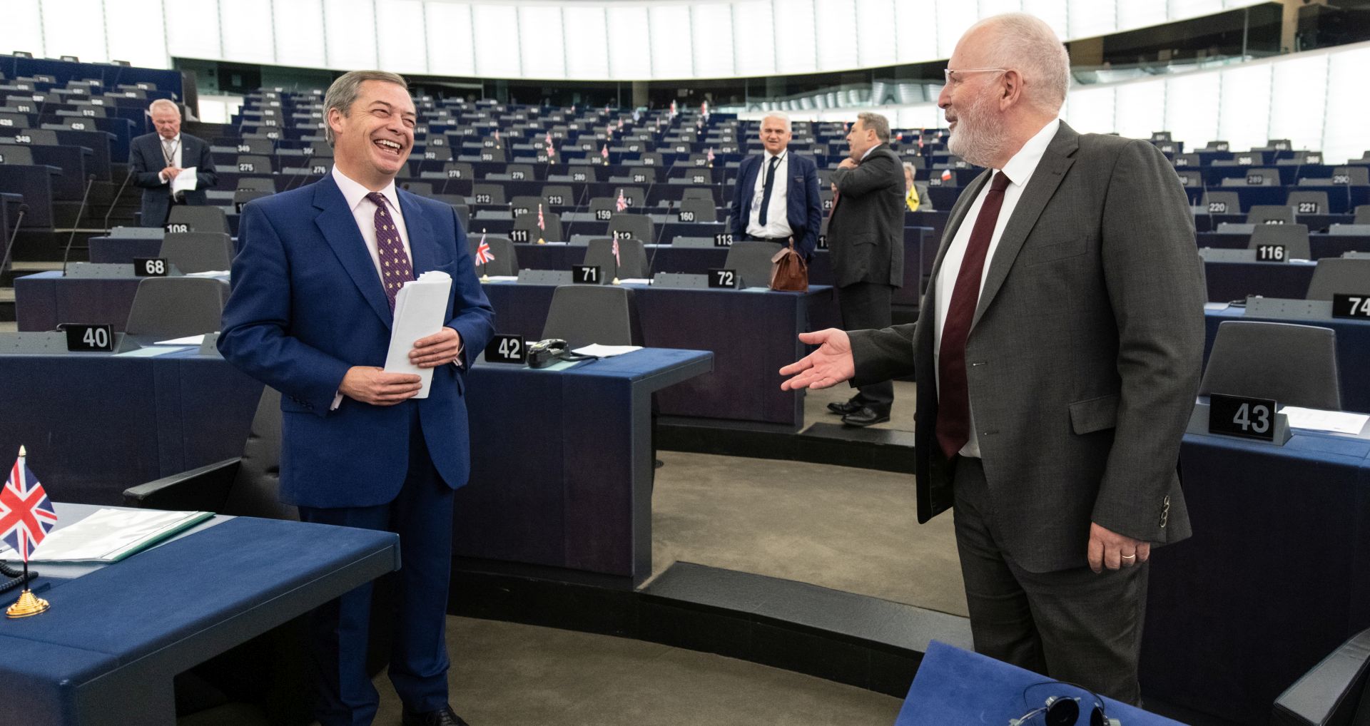 epa07115481 Nigel Farage (L), British Member of the European Parliament and former leader of the UK Independence Party (UKIP) and First Vice-President of European Commission Frans Timmermans (R) of the Netherlands jokes at the European Parliament in Strasbourg, France, 23 October 2018 before the debate about the conclusions of the European Council meeting of 17 and 18 October 2018.  EPA/PATRICK SEEGER